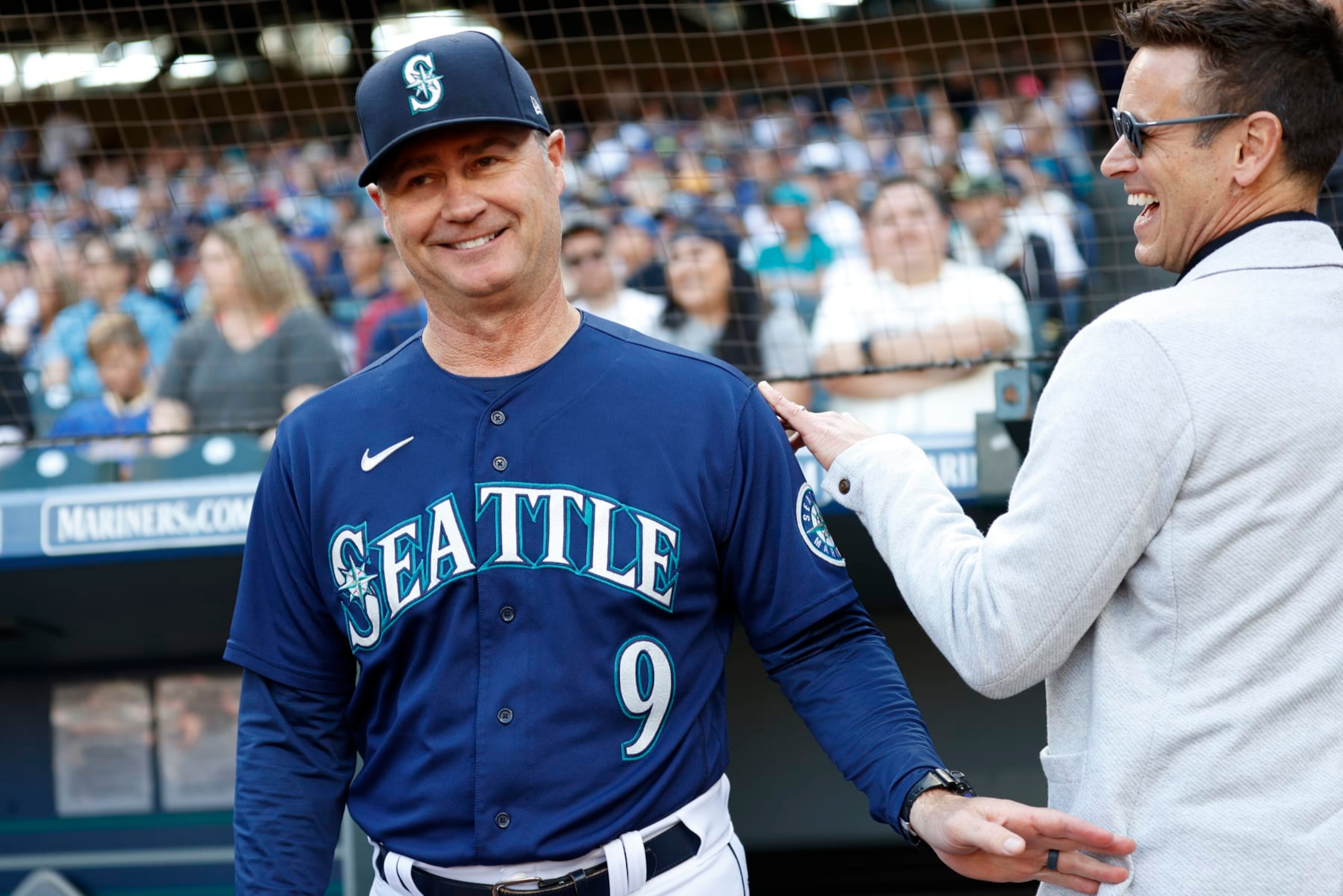 SEATTLE, WASHINGTON - OCTOBER 01: Manager Scott Servais #9 and general manager Jerry Dipoto of the Seattle Mariners look on before the game against the Oakland Athletics at T-Mobile Park on October 01, 2022 in Seattle, Washington. (Photo by Steph Chambers/Getty Images) SEATTLE, WASHINGTON - OCTOBER 01: Manager Scott Servais #9 and general manager Jerry Dipoto of the Seattle Mariners look on before the game against the Oakland Athletics at T-Mobile Park on October 01, 2022 in Seattle, Washington. (Photo by Steph Chambers/Getty Images)