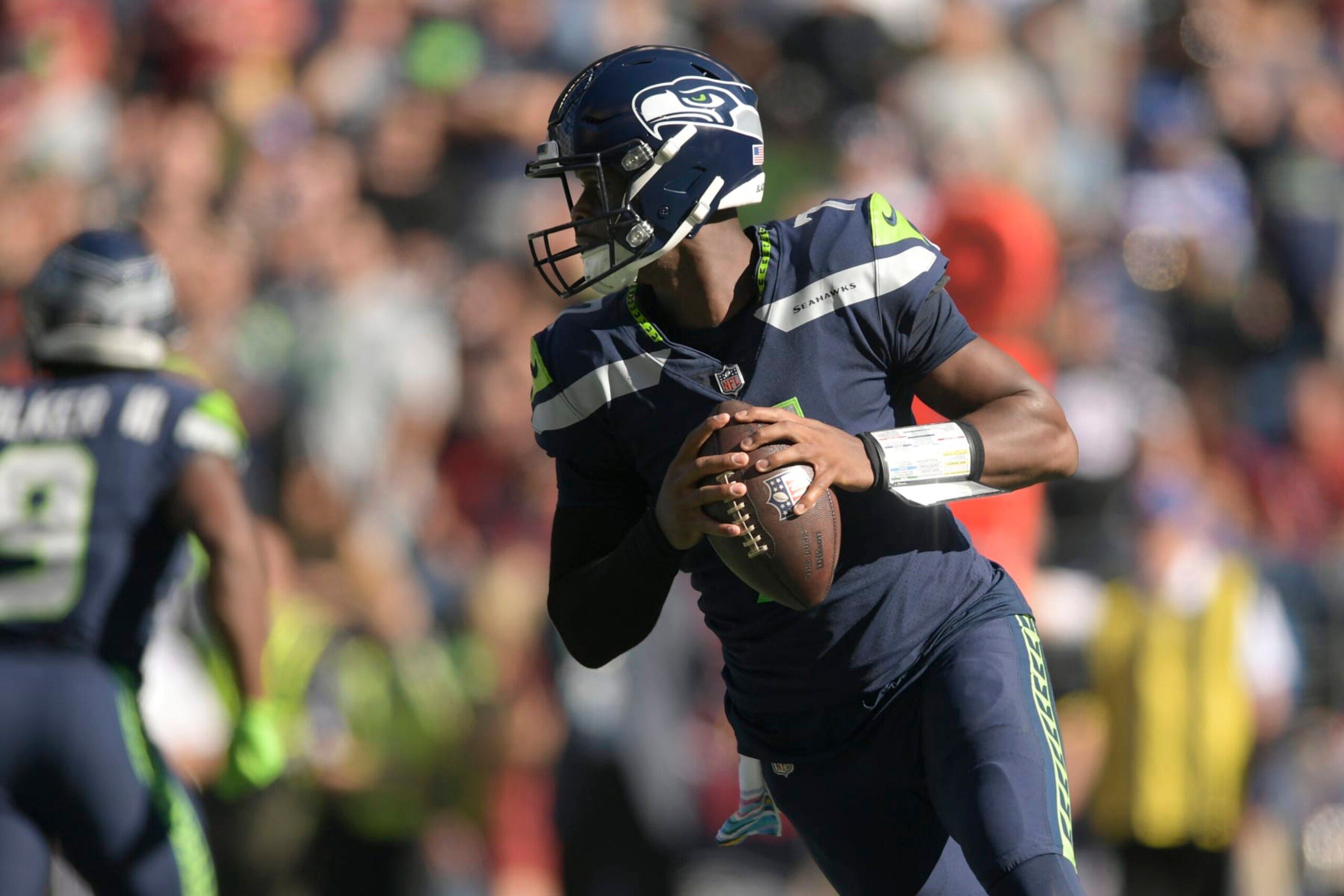 Seattle Seahawks quarterback Geno Smith (7) drops back to pass against the Arizona Cardinals during the first half of an NFL football game in Seattle, Sunday, Oct. 16, 2022. (AP Photo/Caean Couto) Seattle Seahawks quarterback Geno Smith (7) drops back to pass against the Arizona Cardinals during the first half of an NFL football game in Seattle, Sunday, Oct. 16, 2022. (AP Photo/Caean Couto)