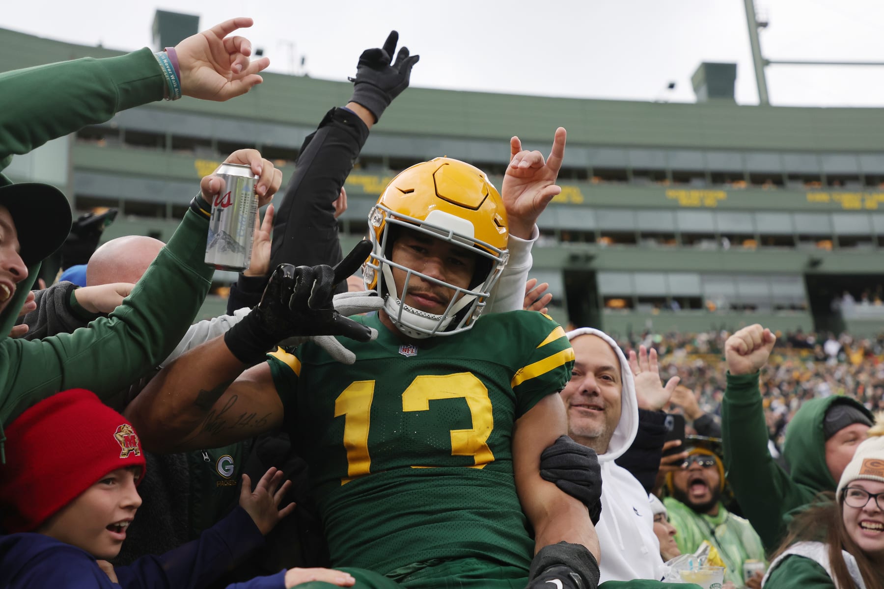 GREEN BAY, WISCONSIN - OCTOBER 16: Allen Lazard #13 of the Green Bay Packers celebrates with fans after scoring in the third quarter of a game against the New York Jets at Lambeau Field on October 16, 2022 in Green Bay, Wisconsin. (Photo by Stacy Revere/Getty Images)