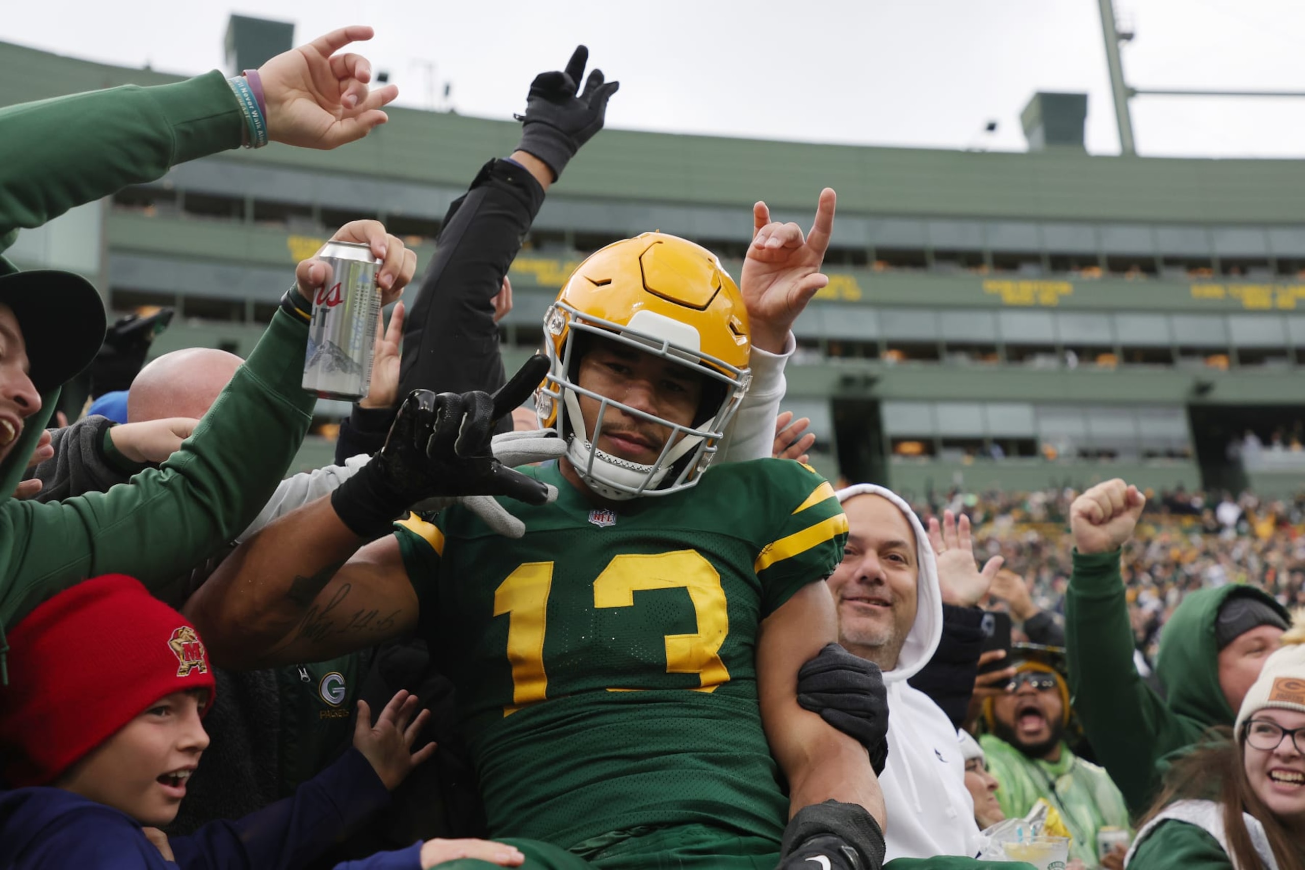 GREEN BAY, WISCONSIN - OCTOBER 16: Allen Lazard #13 of the Green Bay Packers celebrates with fans after scoring in the third quarter of a game against the New York Jets at Lambeau Field on October 16, 2022 in Green Bay, Wisconsin. (Photo by Stacy Revere/Getty Images)