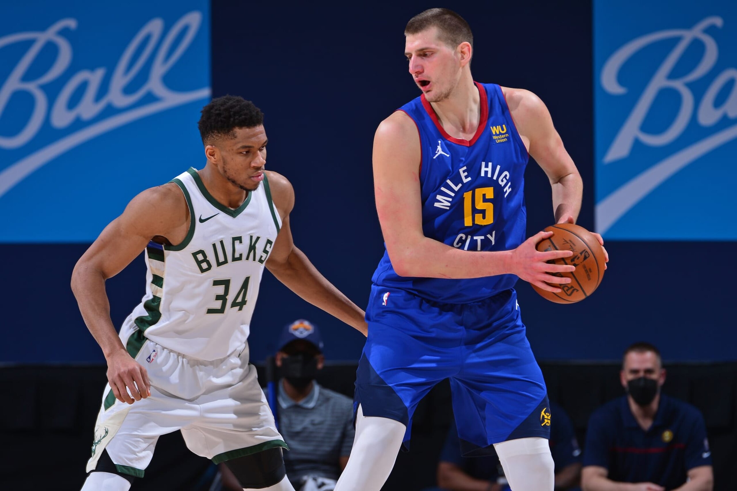 DENVER, CO - FEBRUARY 8: Giannis Antetokounmpo #34 of the Milwaukee Bucks plays defense as Nikola Jokic #15 of the Denver Nuggets handles the ball during the game on February 8, 2021 at the Ball Arena in Denver, Colorado. NOTE TO USER: User expressly acknowledges and agrees that, by downloading and/or using this Photograph, user is consenting to the terms and conditions of the Getty Images License Agreement. Mandatory Copyright Notice: Copyright 2021 NBAE (Photo by Bart Young/NBAE via Getty Images)