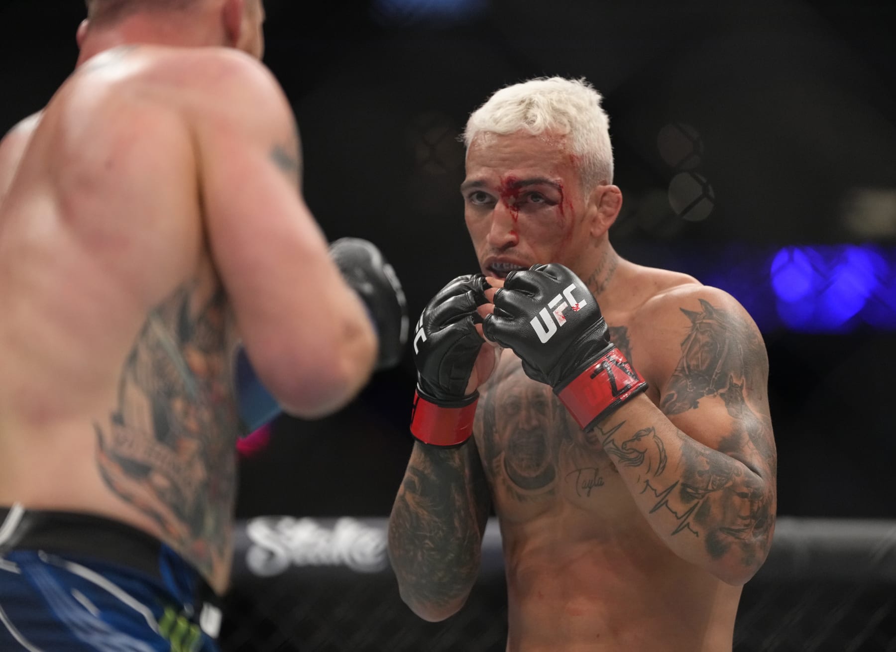 PHOENIX, ARIZONA - MAY 07: (R-L) Charles Oliveira of Brazil battles Justin Gaethje in the UFC lightweight championship fight during the UFC 274 event at Footprint Center on May 07, 2022 in Phoenix, Arizona. (Photo by Jeff Bottari/Zuffa LLC)