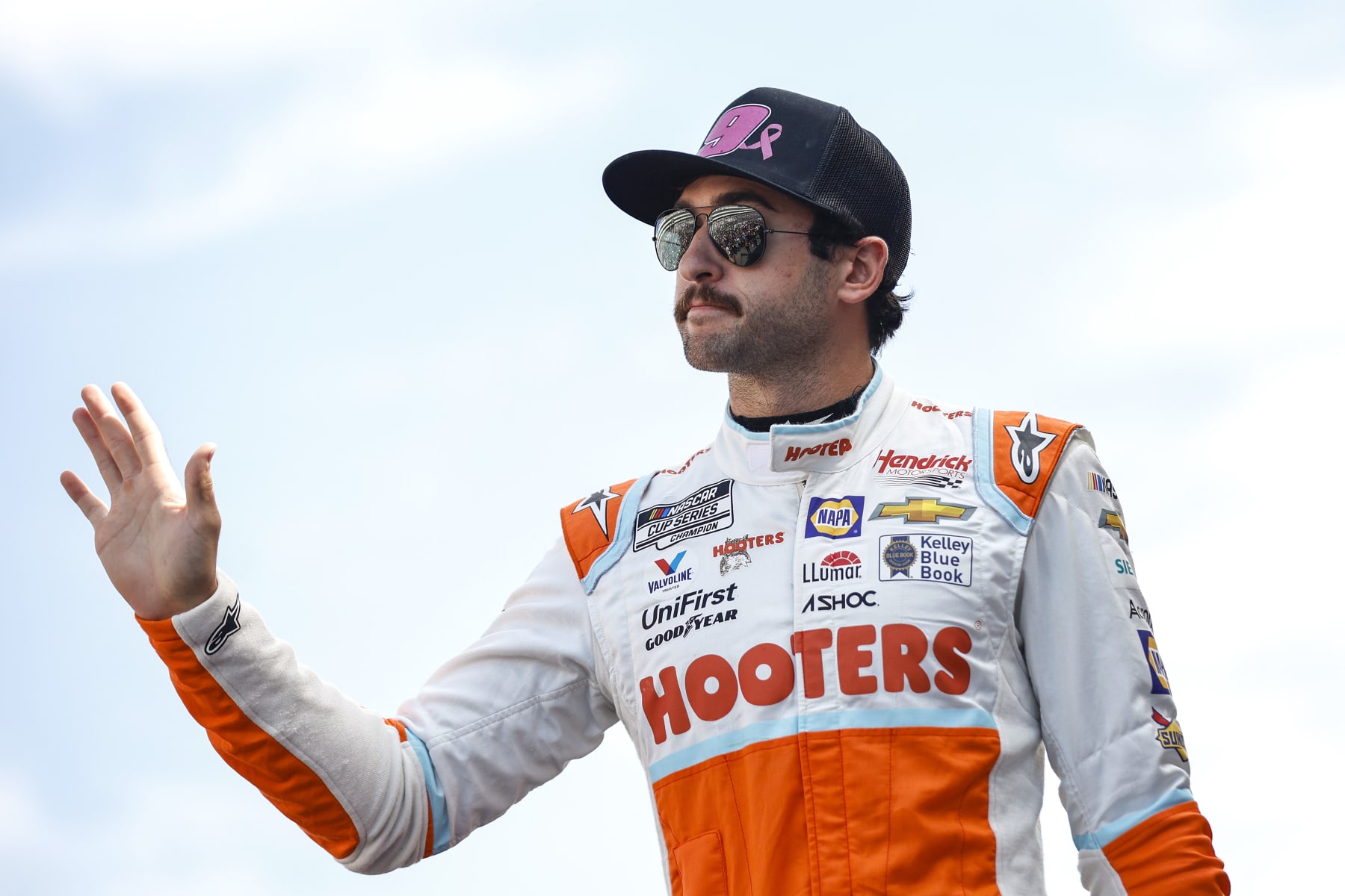 LAS VEGAS, NEVADA - OCTOBER 16: Chase Elliott, driver of the #9 Hooters Chevrolet, waves to fans as he walks onstage during driver intros prior to the NASCAR Cup Series South Point 400 at Las Vegas Motor Speedway on October 16, 2022 in Las Vegas, Nevada. (Photo by Sean Gardner/Getty Images)