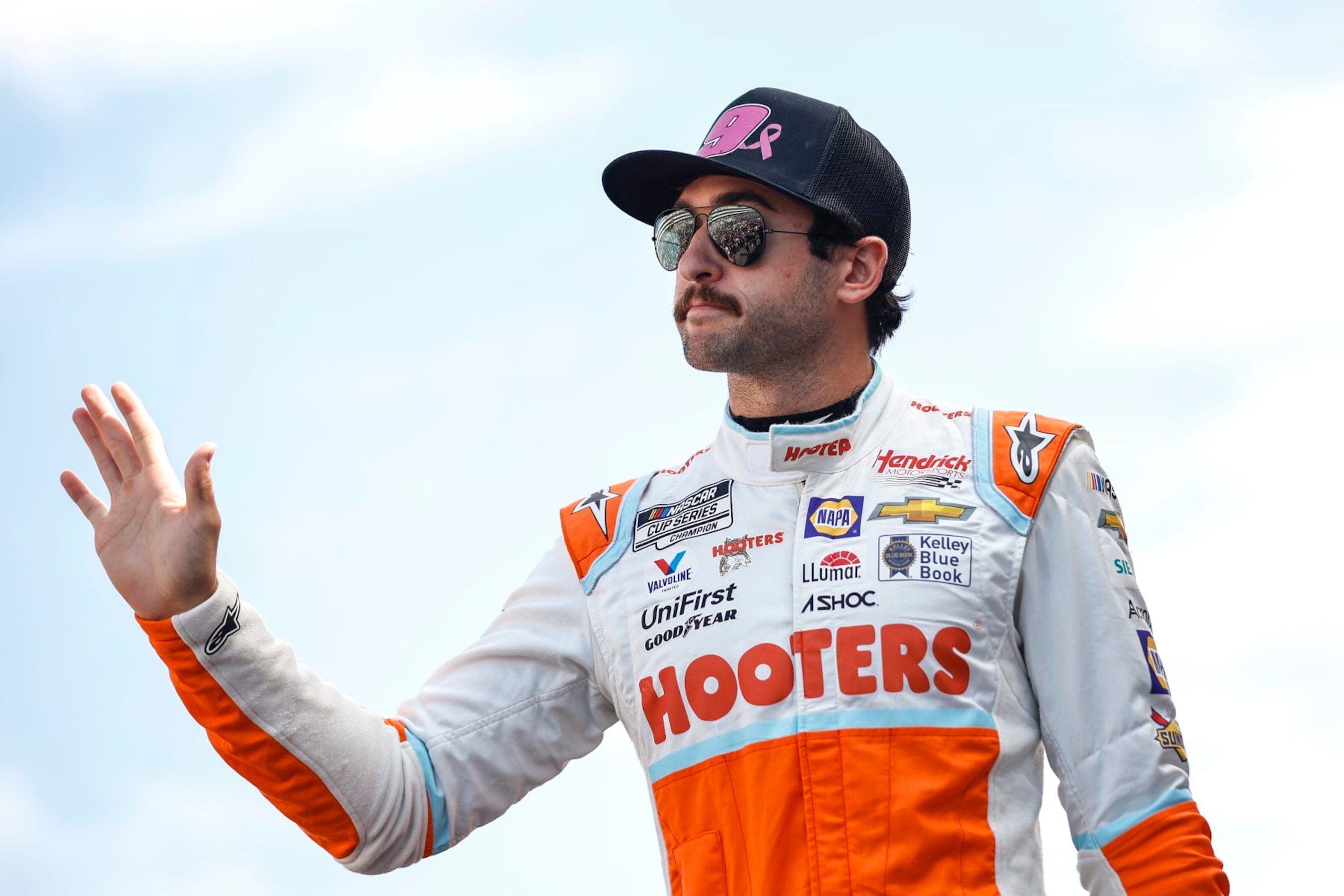 LAS VEGAS, NEVADA - OCTOBER 16: Chase Elliott, driver of the #9 Hooters Chevrolet, waves to fans as he walks onstage during driver intros prior to the NASCAR Cup Series South Point 400 at Las Vegas Motor Speedway on October 16, 2022 in Las Vegas, Nevada. (Photo by Sean Gardner/Getty Images)