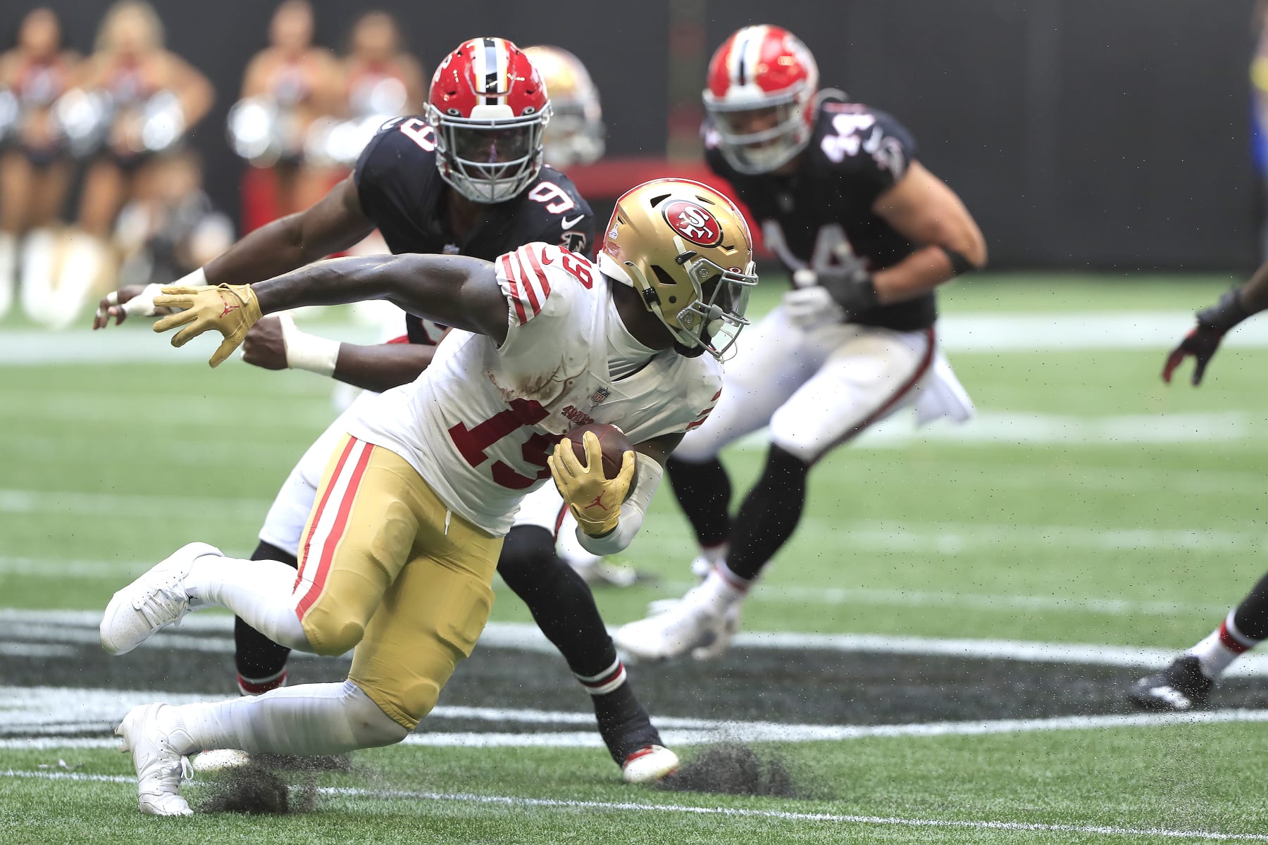 ATLANTA, GA - OCTOBER 16: Atlanta Falcons linebacker Lorenzo Carter (9) seeks out San Francisco 49ers wide receiver Deebo Samuel (19) during the NFL football game between the Atlanta Falcons and the San Francisco 49ers on October 16, 2022 at Mercedes-Benz Stadium in Atlanta, Georgia.  (Photo by David J. Griffin/Icon Sportswire via Getty Images)