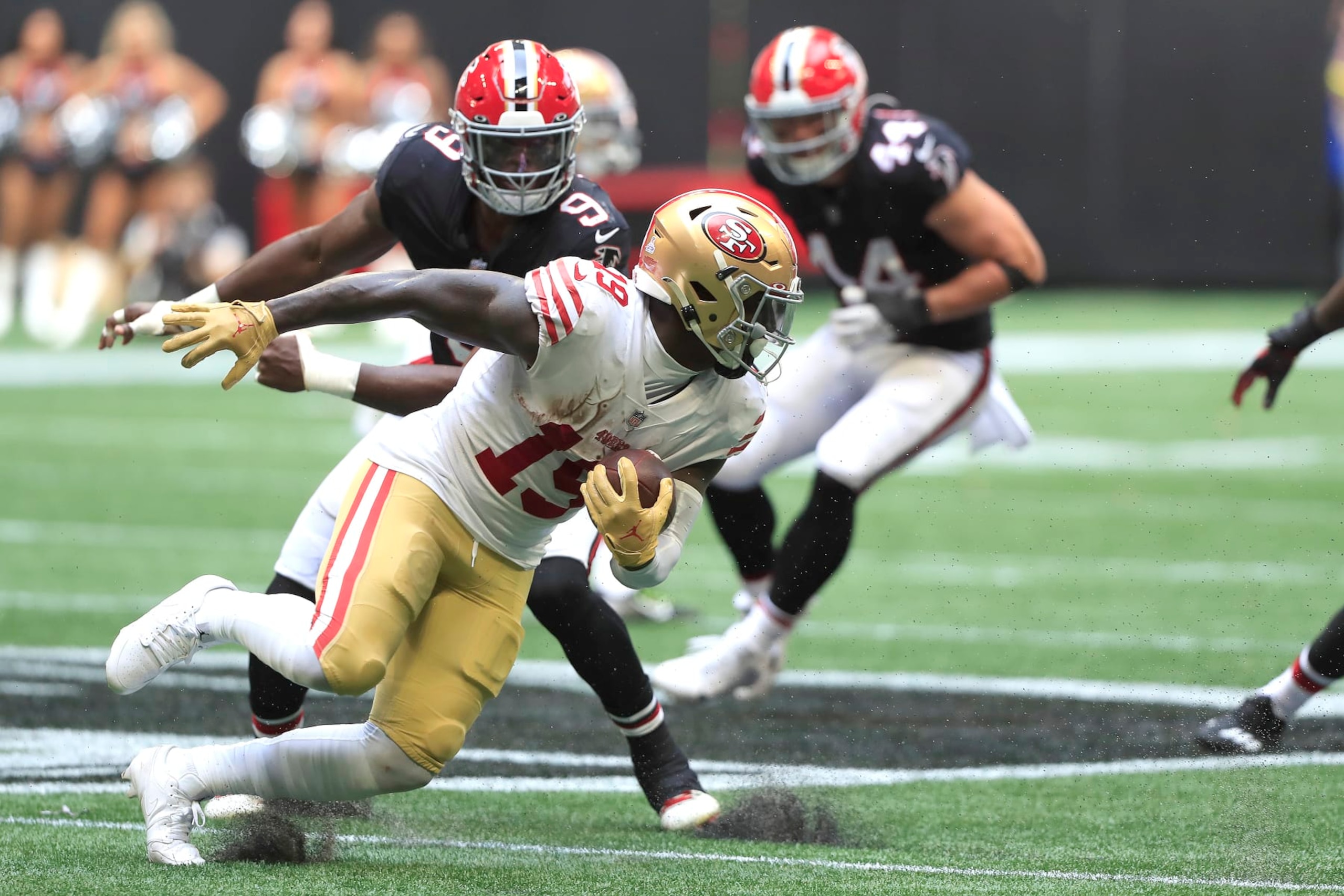 ATLANTA, GA - OCTOBER 16: Atlanta Falcons linebacker Lorenzo Carter (9) seeks out San Francisco 49ers wide receiver Deebo Samuel (19) during the NFL football game between the Atlanta Falcons and the San Francisco 49ers on October 16, 2022 at Mercedes-Benz Stadium in Atlanta, Georgia.  (Photo by David J. Griffin/Icon Sportswire via Getty Images)