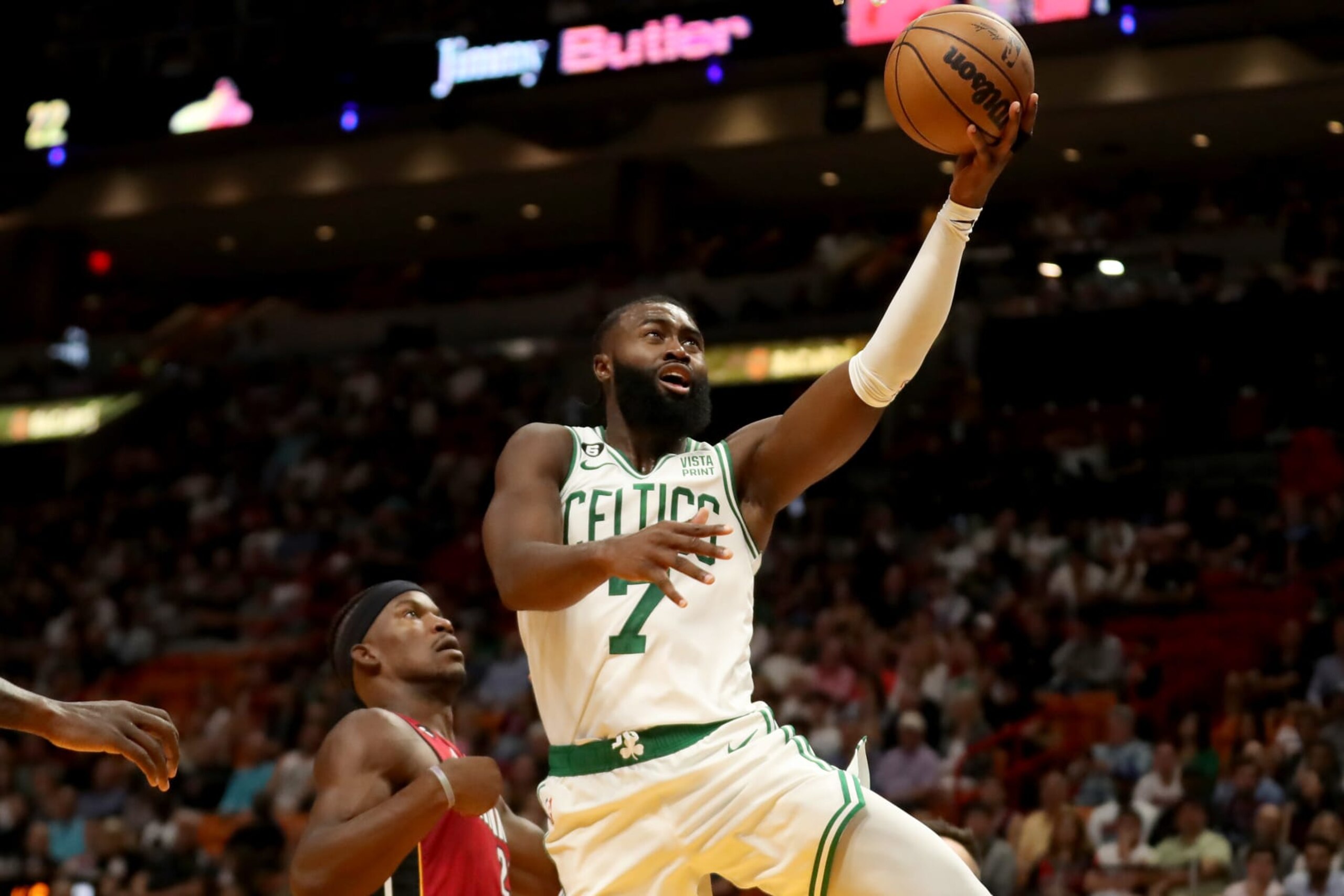 MIAMI, FLORIDA - OCTOBER 21: Jaylen Brown #7 of the Boston Celtics shoots past Jimmy Butler #22 of the Miami Heat during the first quarter at FTX Arena on October 21, 2022 in Miami, Florida. NOTE TO USER: User expressly acknowledges and agrees that, by downloading and or using this photograph, User is consenting to the terms and conditions of the Getty Images License Agreement. (Photo by Megan Briggs/Getty Images)