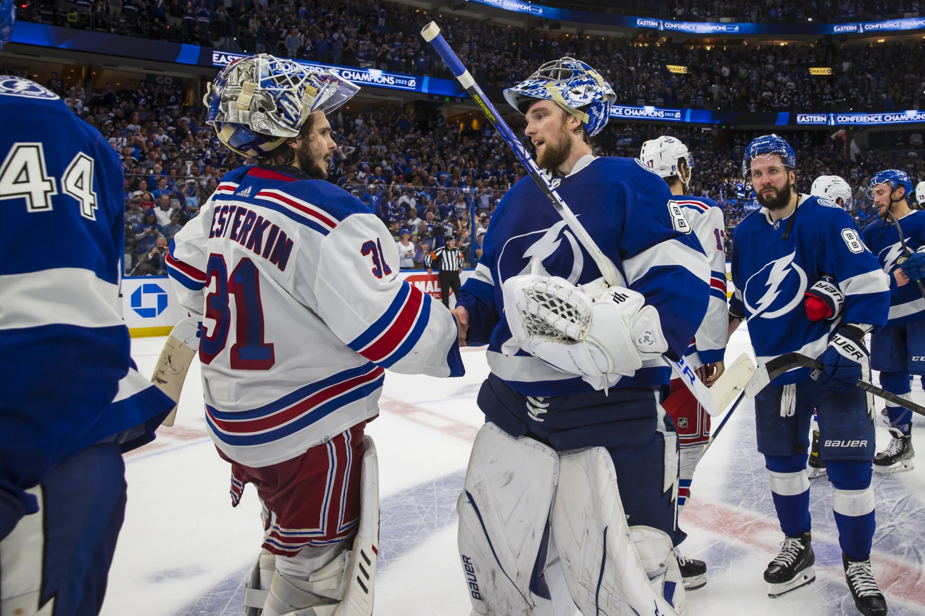TAMPA, FL - JUNE 11: Goalie Andrei Vasilevskiy #88 of the Tampa Bay Lightning shakes hands with Igor Shesterkin #31 of the New York Rangers after Game Six of the Eastern Conference Final of the 2022 Stanley Cup Playoffs at Amalie Arena on June 11, 2022 in Tampa, Florida. (Photo by Mark LoMoglio/NHLI via Getty Images)