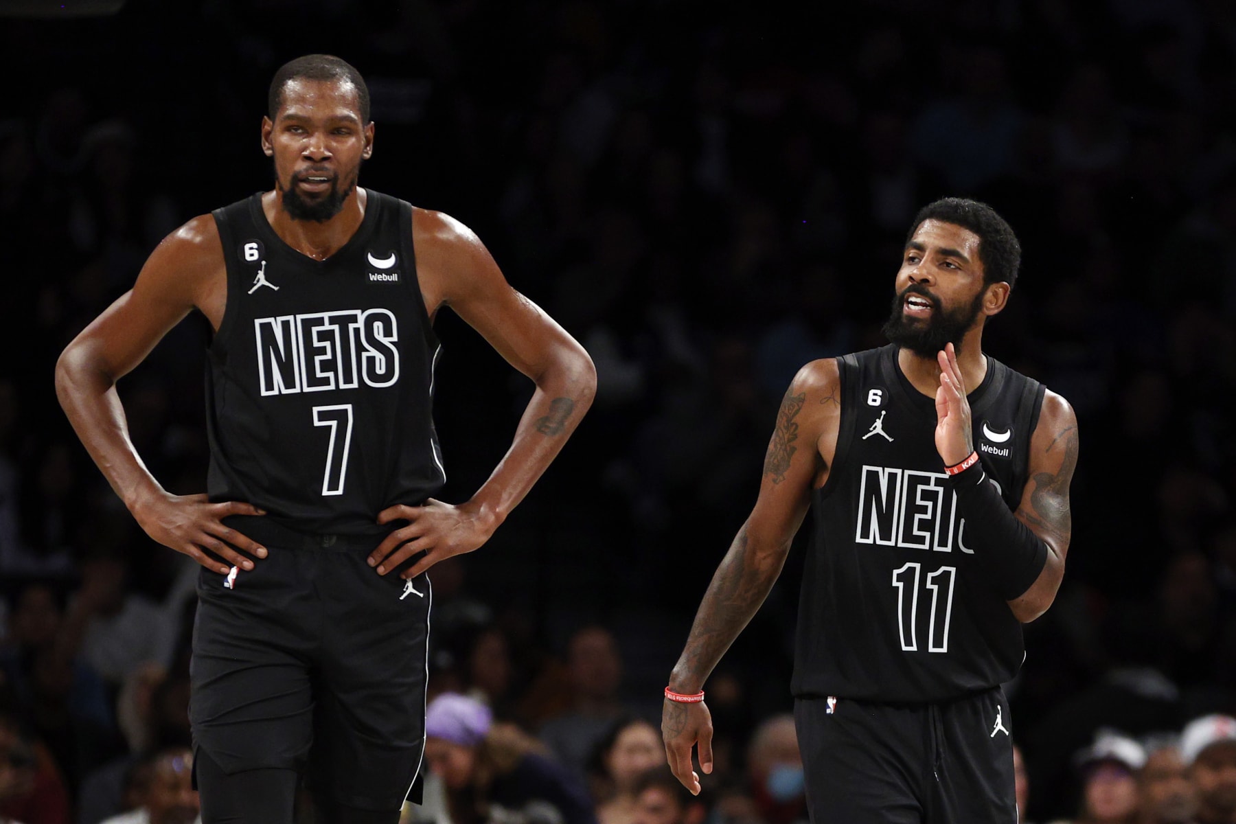 NEW YORK, NEW YORK - OCTOBER 21: Kevin Durant #7 and Kyrie Irving #11 of the Brooklyn Nets look on during the first half against the Toronto Raptors at Barclays Center on October 21, 2022 in the Brooklyn borough of New York City. NOTE TO USER: User expressly acknowledges and agrees that, by downloading and or using this photograph, User is consenting to the terms and conditions of the Getty Images License Agreement. (Photo by Sarah Stier/Getty Images)