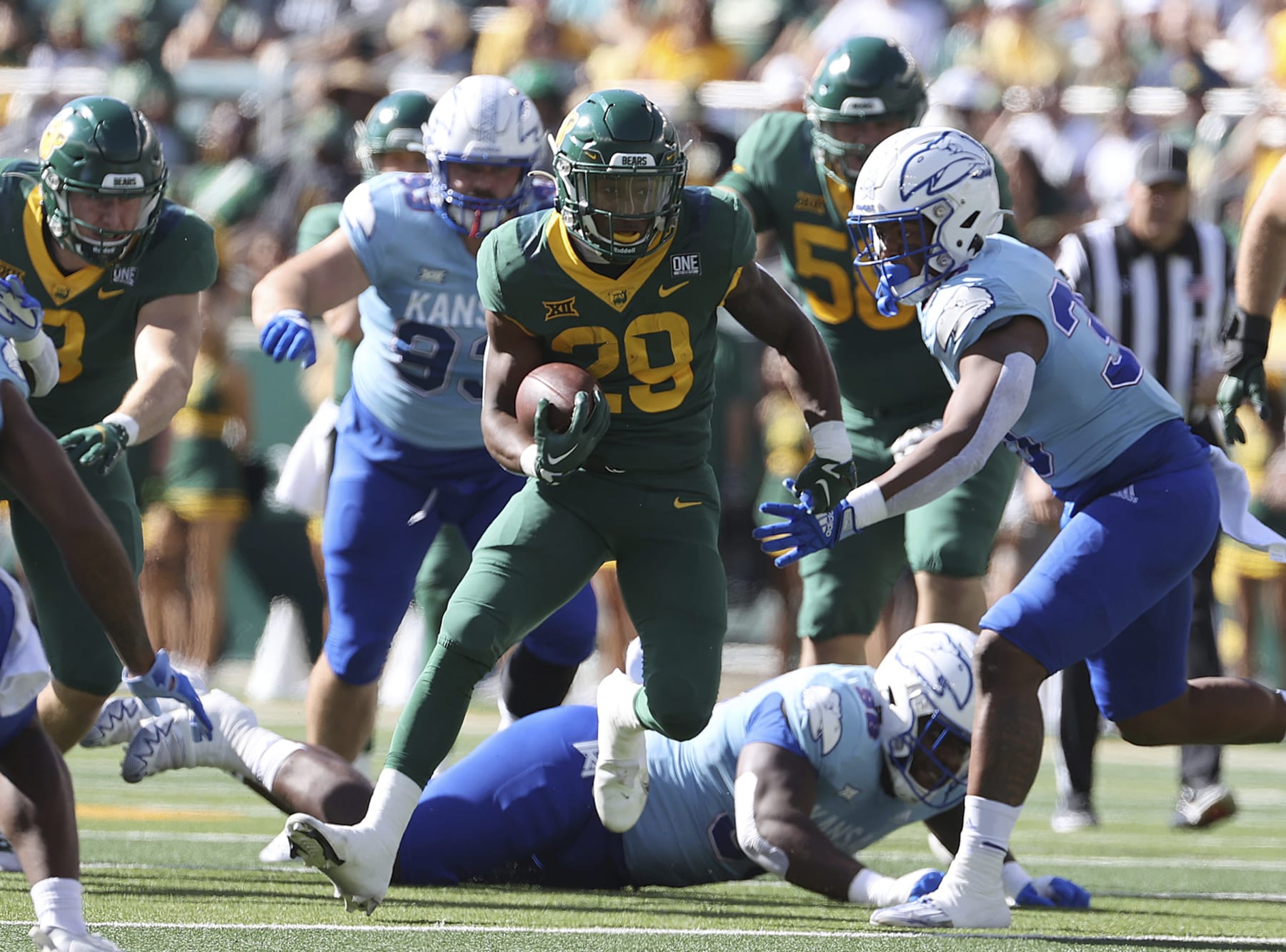 Baylor running back Richard Reese runs through the Kansas defense in the first half of an NCAA college football game, Saturday, Oct. 22, 2022, in Waco, Texas. (AP Photo/Jerry Larson)