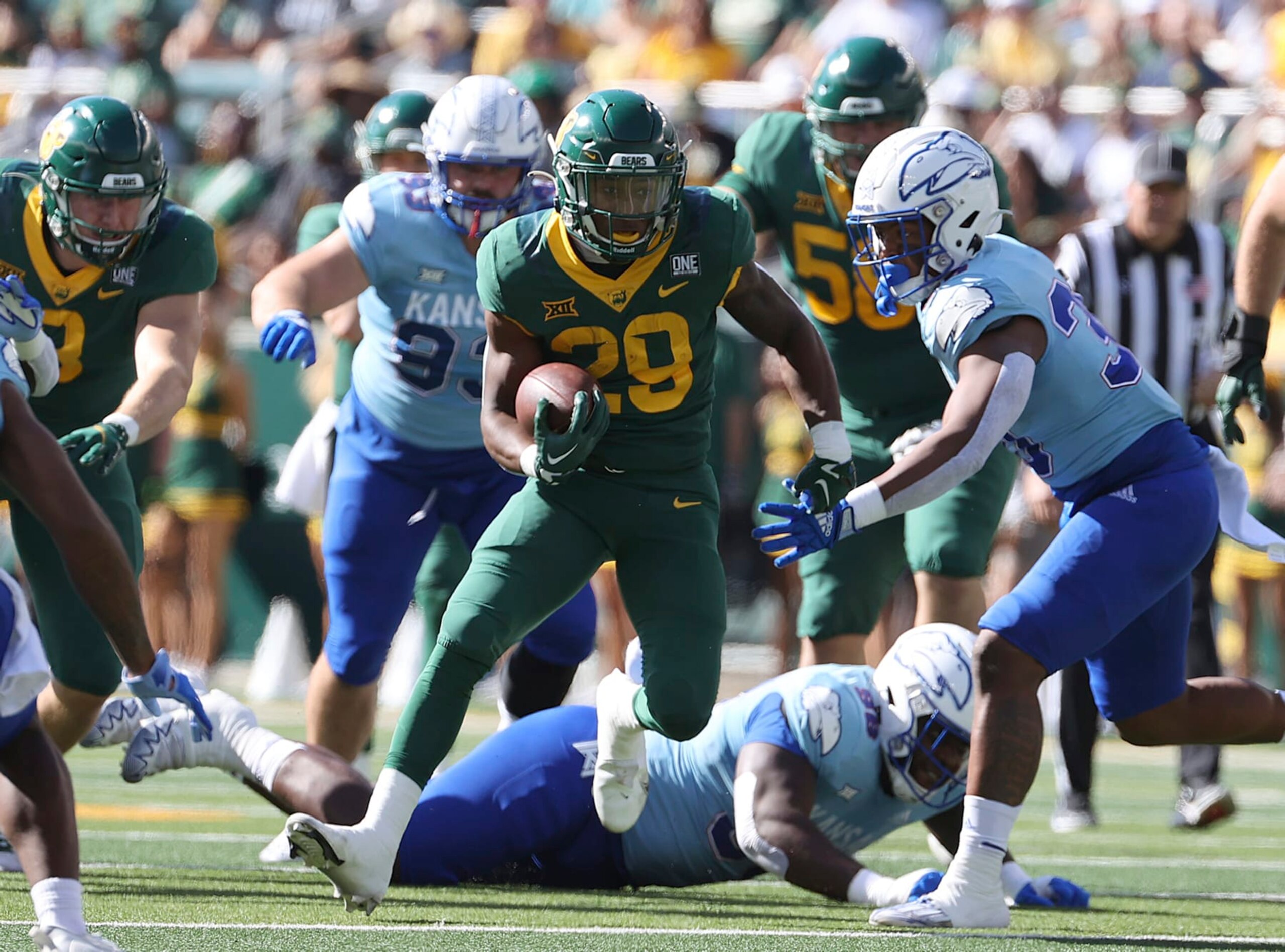 Baylor running back Richard Reese runs through the Kansas defense in the first half of an NCAA college football game, Saturday, Oct. 22, 2022, in Waco, Texas. (AP Photo/Jerry Larson)