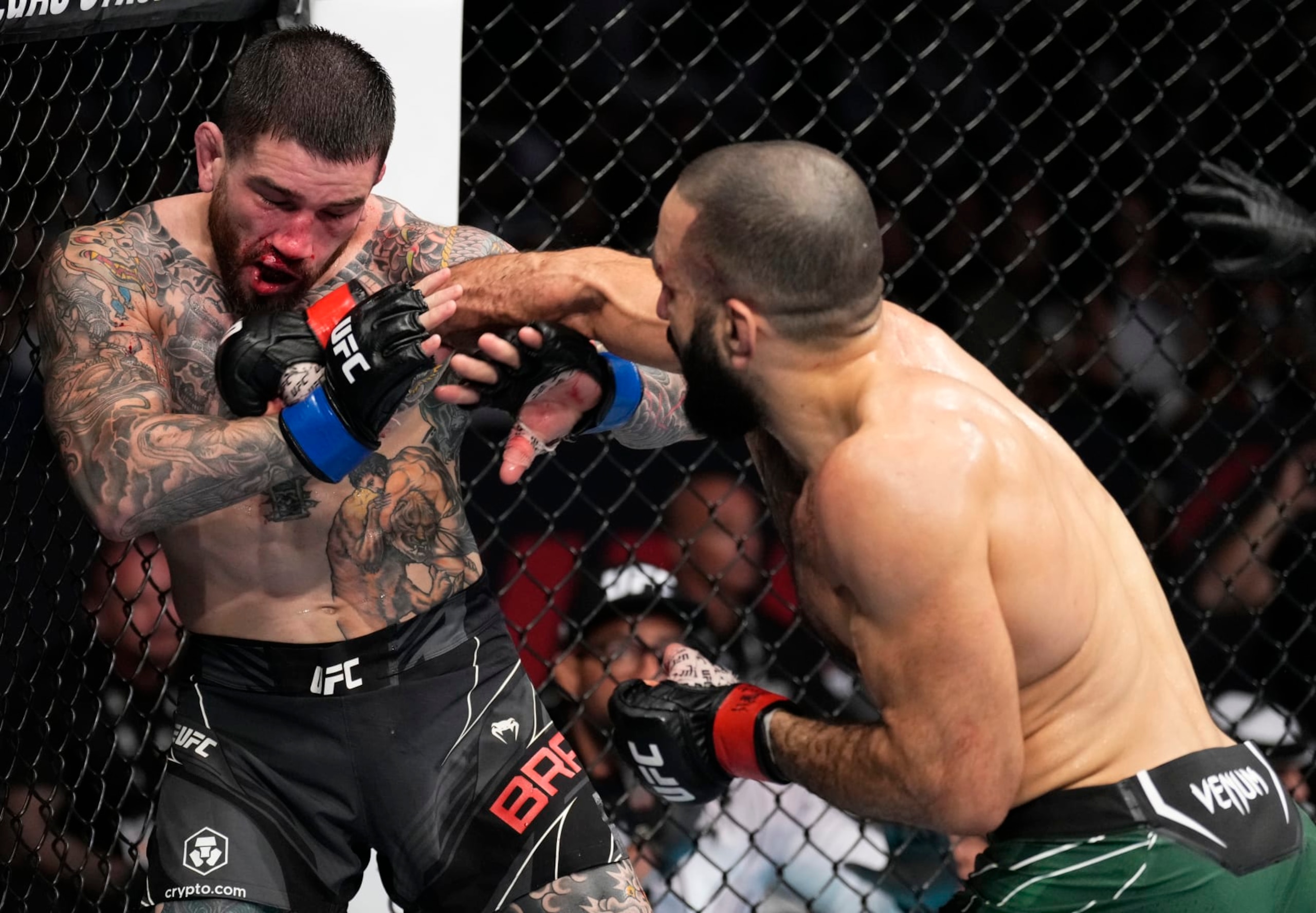 ABU DHABI, UNITED ARAB EMIRATES - OCTOBER 22: (R-L) Belal Muhammad punches Sean Brady in a welterweight fight during the UFC 280 event at Etihad Arena on October 22, 2022 in Abu Dhabi, United Arab Emirates. (Photo by Chris Unger/Zuffa LLC)
