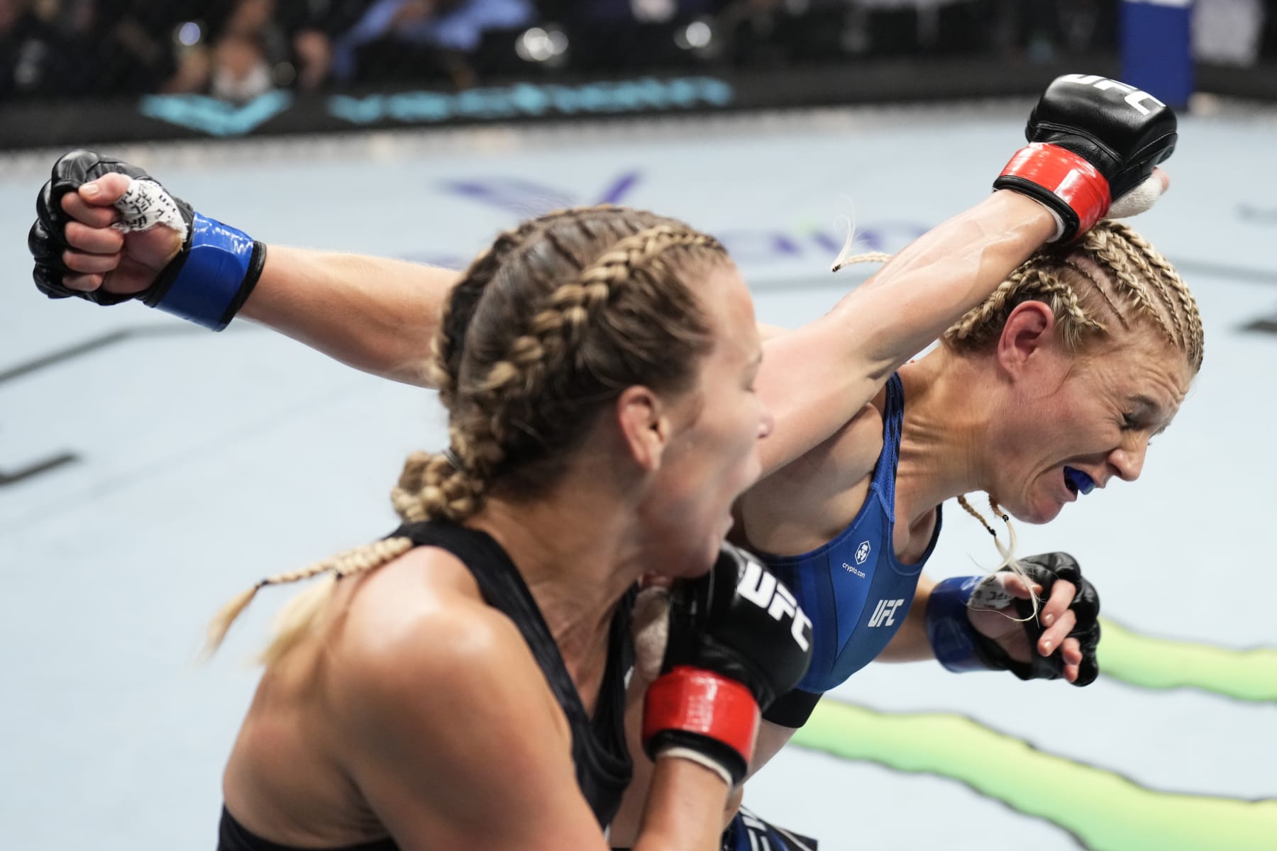 ABU DHABI, UNITED ARAB EMIRATES - OCTOBER 22: (L-R) Katlyn Chookagian punches Manon Fiorot of France in a flyweight fight during the UFC 280 event at Etihad Arena on October 22, 2022 in Abu Dhabi, United Arab Emirates. (Photo by Chris Unger/Zuffa LLC)