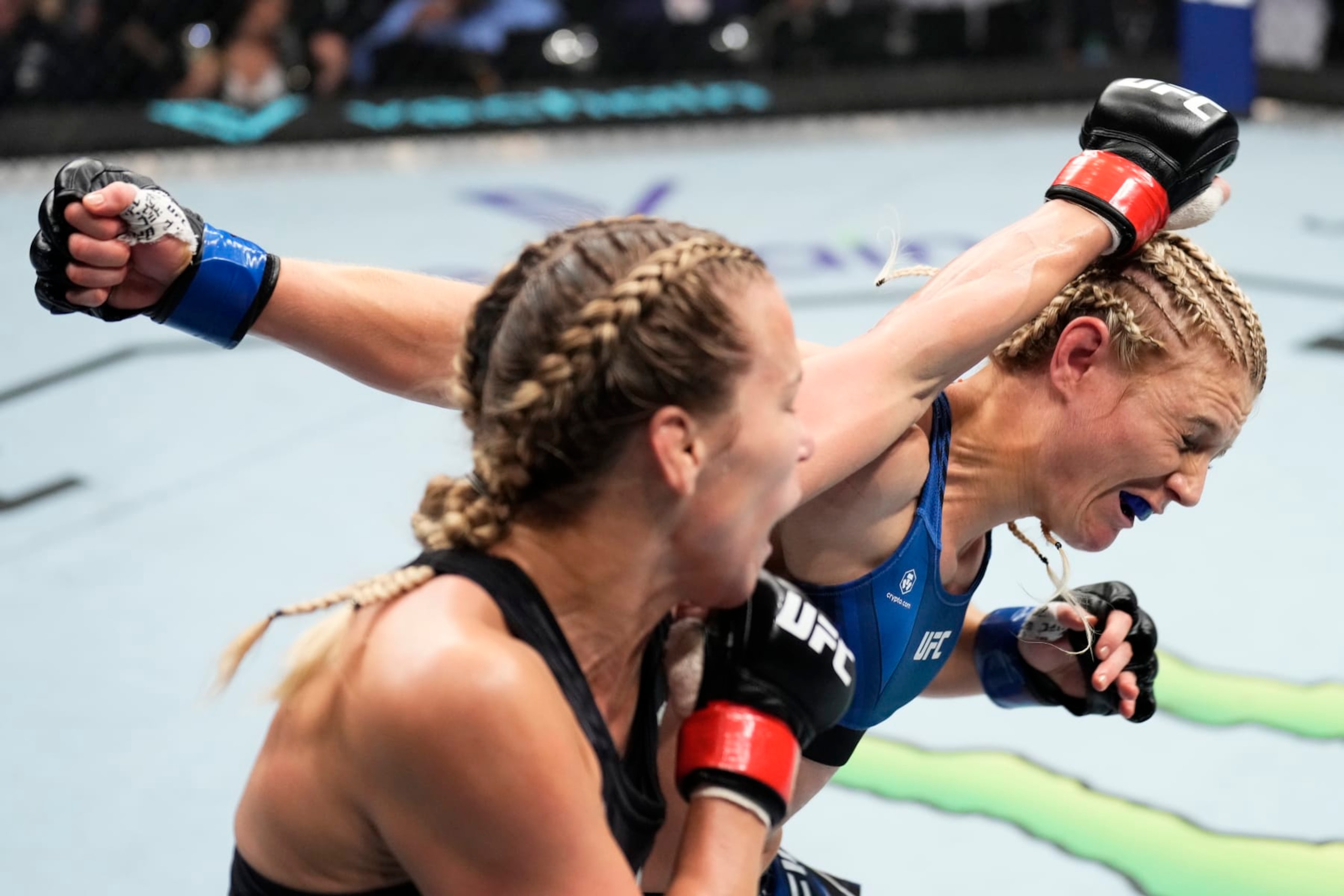ABU DHABI, UNITED ARAB EMIRATES - OCTOBER 22: (L-R) Katlyn Chookagian punches Manon Fiorot of France in a flyweight fight during the UFC 280 event at Etihad Arena on October 22, 2022 in Abu Dhabi, United Arab Emirates. (Photo by Chris Unger/Zuffa LLC)