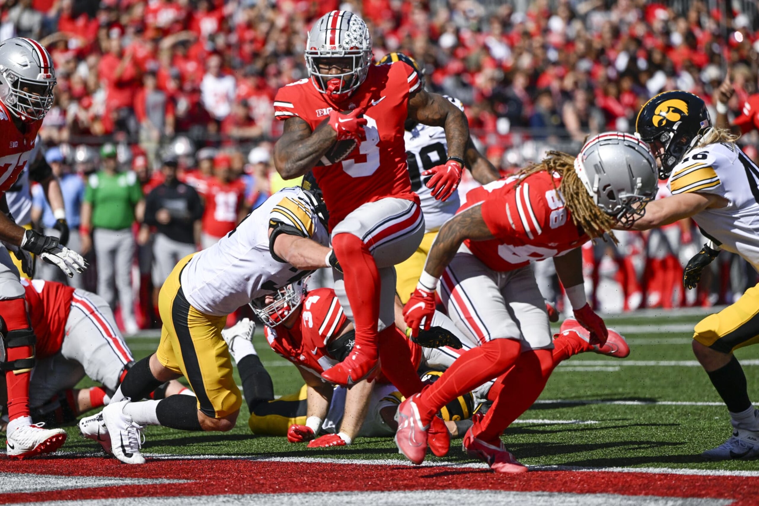 COLUMBUS, OHIO - OCTOBER 22: Running back Miyan Williams #3 of the Ohio State Buckeyes scores a touchdown in the first quarter against the Iowa Hawkeyes at Ohio Stadium on October 22, 2022 in Columbus, Ohio. (Photo by Gaelen Morse/Getty Images)