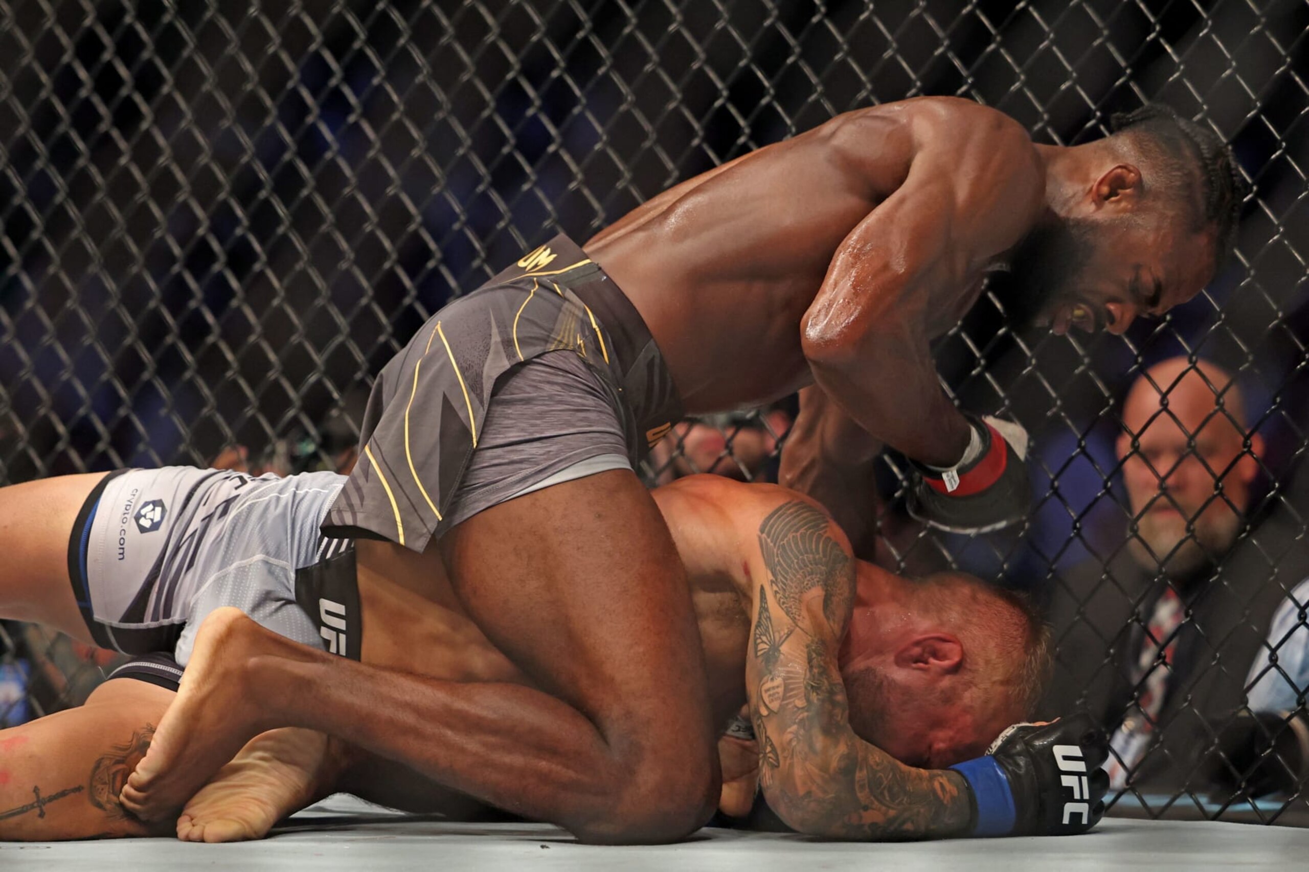 Aljamain Sterling (L) competes against TJ Dillashaw in the bantamweight championship at the Ultimate Fighting Championship (UFC) event at the Etihad Arena in Abu Dhabi on October 22, 2022. (Photo by Giuseppe CACACE / AFP) (Photo by GIUSEPPE CACACE/AFP via Getty Images)