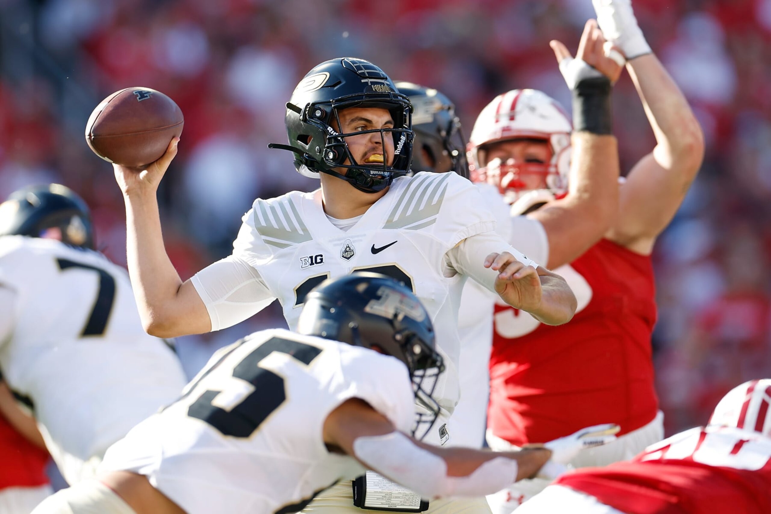 MADISON, WISCONSIN - OCTOBER 22: Aidan O'Connell #16 of the Purdue Boilermakers throws a pass in the second quarter against the Wisconsin Badgers at Camp Randall Stadium on October 22, 2022 in Madison, Wisconsin. (Photo by John Fisher/Getty Images)