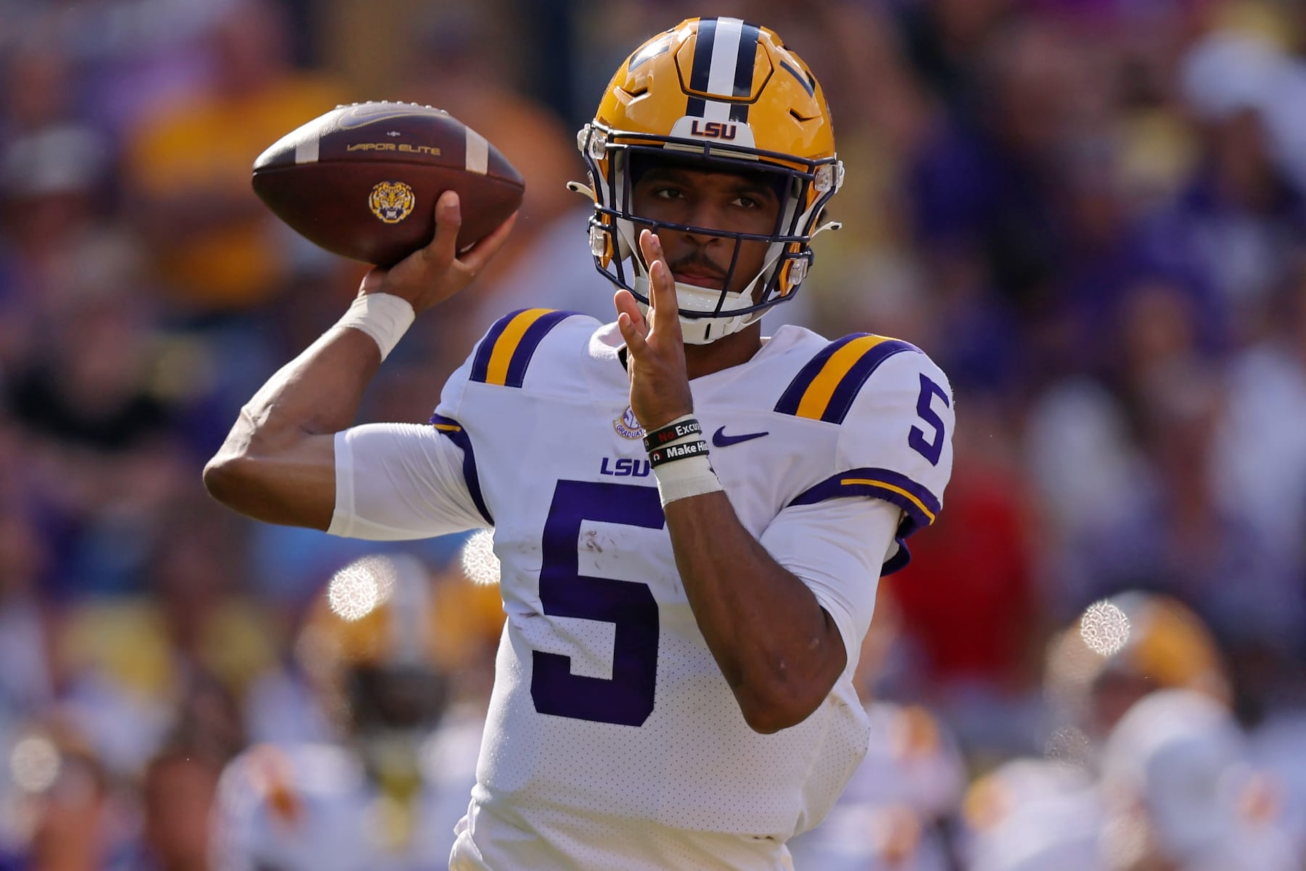 BATON ROUGE, LOUISIANA - OCTOBER 22: Jayden Daniels #5 of the LSU Tigers throws the ball during the first half against the Mississippi Rebels at Tiger Stadium on October 22, 2022 in Baton Rouge, Louisiana. (Photo by Jonathan Bachman/Getty Images)