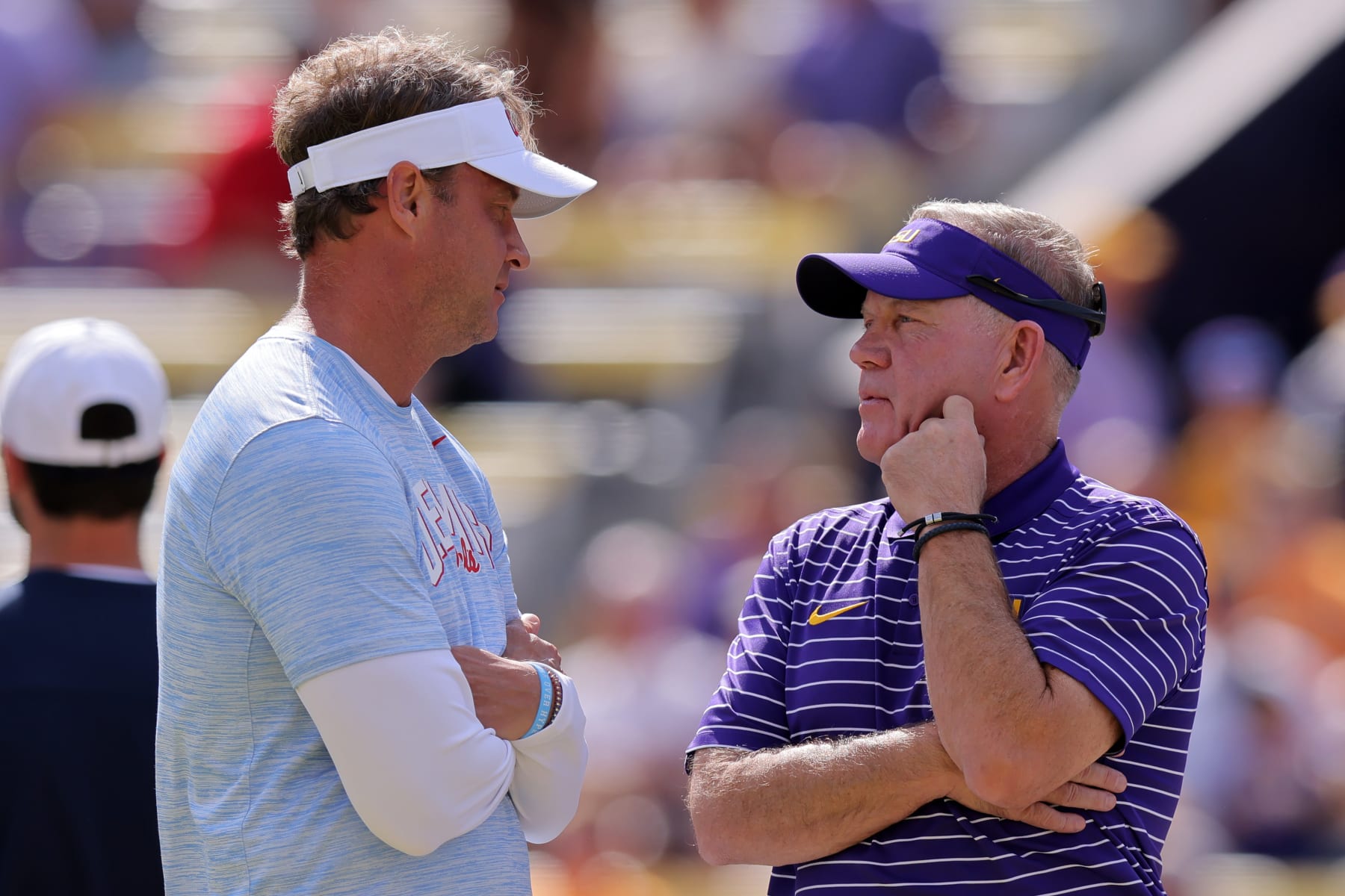 BATON ROUGE, LOUISIANA - OCTOBER 22: Head coach Brian Kelly of the LSU Tigers and head coach Lane Kiffin of the Mississippi Rebels talk before a game at Tiger Stadium on October 22, 2022 in Baton Rouge, Louisiana. (Photo by Jonathan Bachman/Getty Images)