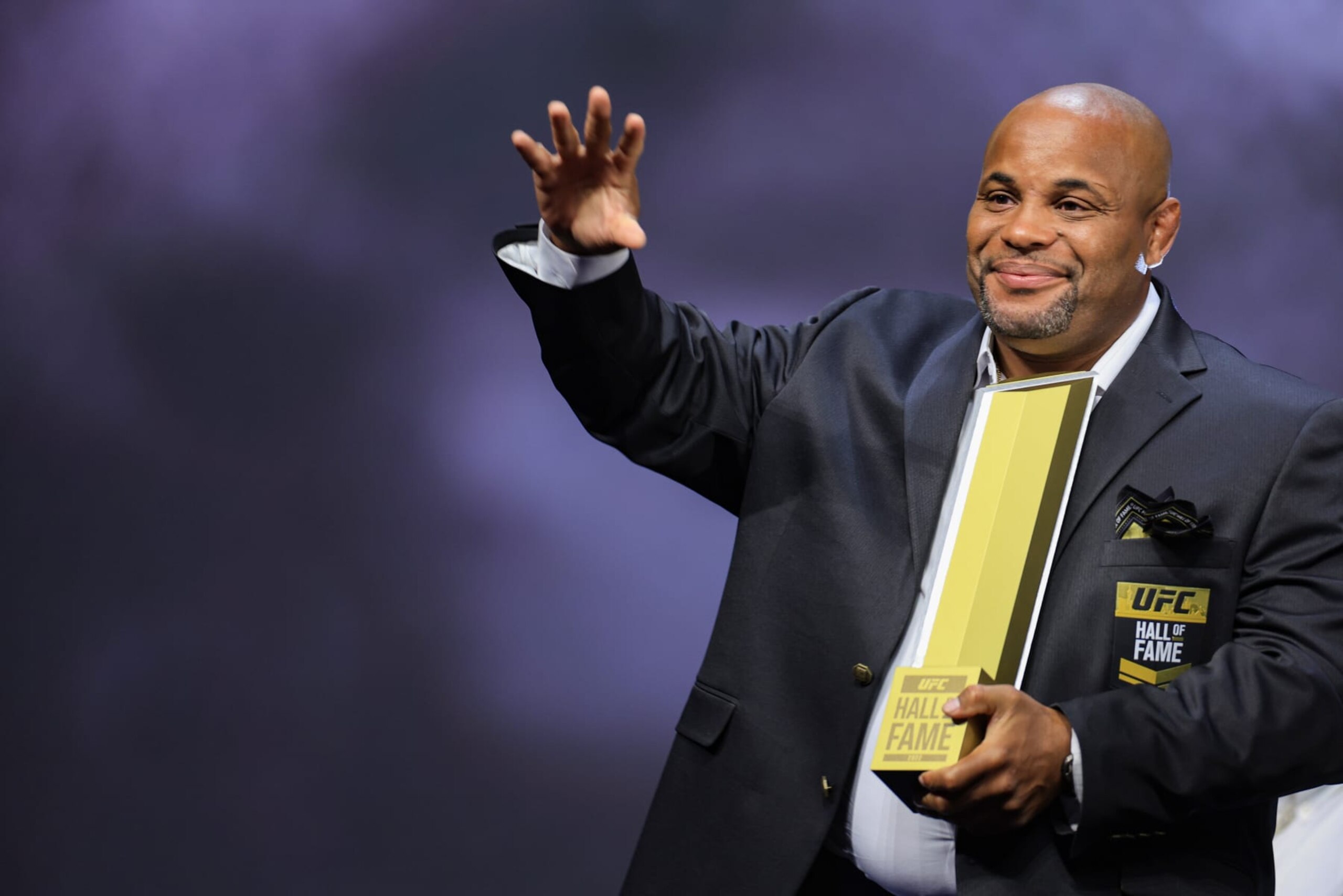 LAS VEGAS, NEVADA - JUNE 30: Daniel Cormier receives his trophy and jacket during the UFC Hall of Fame induction ceremony at T-Mobile Arena on June 30, 2022 in Las Vegas, Nevada. (Photo by Carmen Mandato/Getty Images)