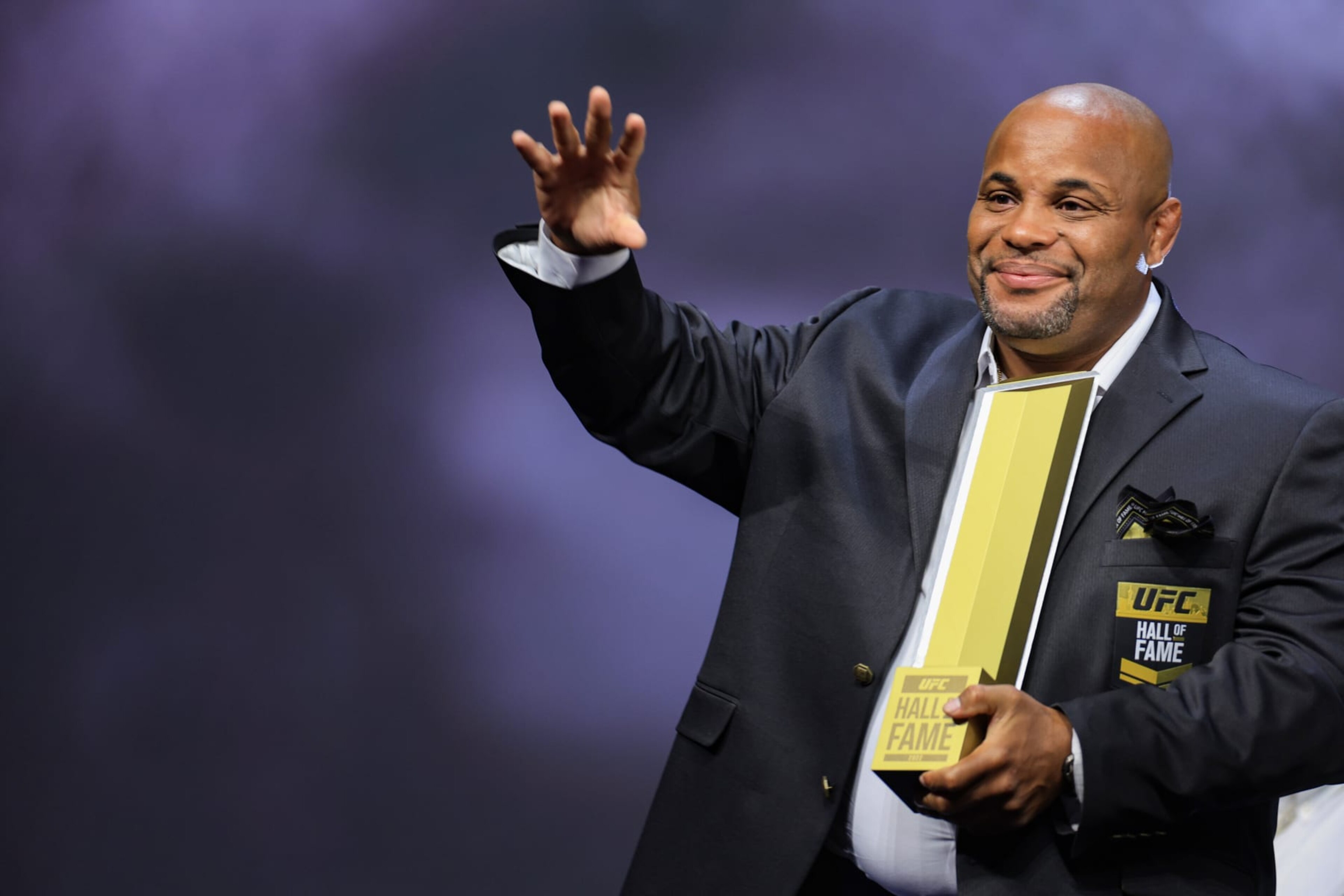 LAS VEGAS, NEVADA - JUNE 30: Daniel Cormier receives his trophy and jacket during the UFC Hall of Fame induction ceremony at T-Mobile Arena on June 30, 2022 in Las Vegas, Nevada. (Photo by Carmen Mandato/Getty Images)