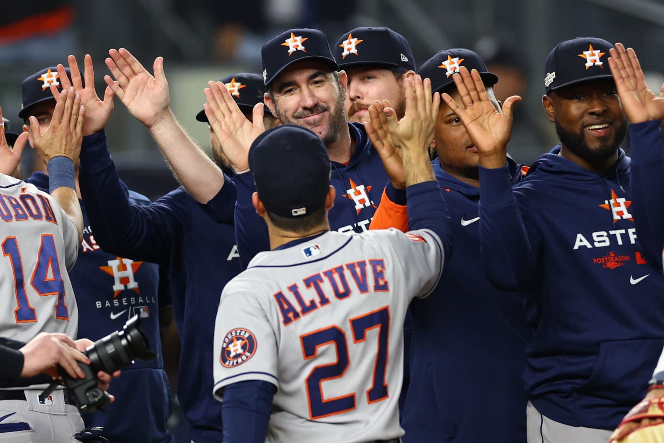NEW YORK, NEW YORK - OCTOBER 22: Jose Altuve #27 of the Houston Astros high fives teammates following their 5-0 victory against the New York Yankees in game three of the American League Championship Series at Yankee Stadium on October 22, 2022 in New York City. (Photo by Elsa/Getty Images)