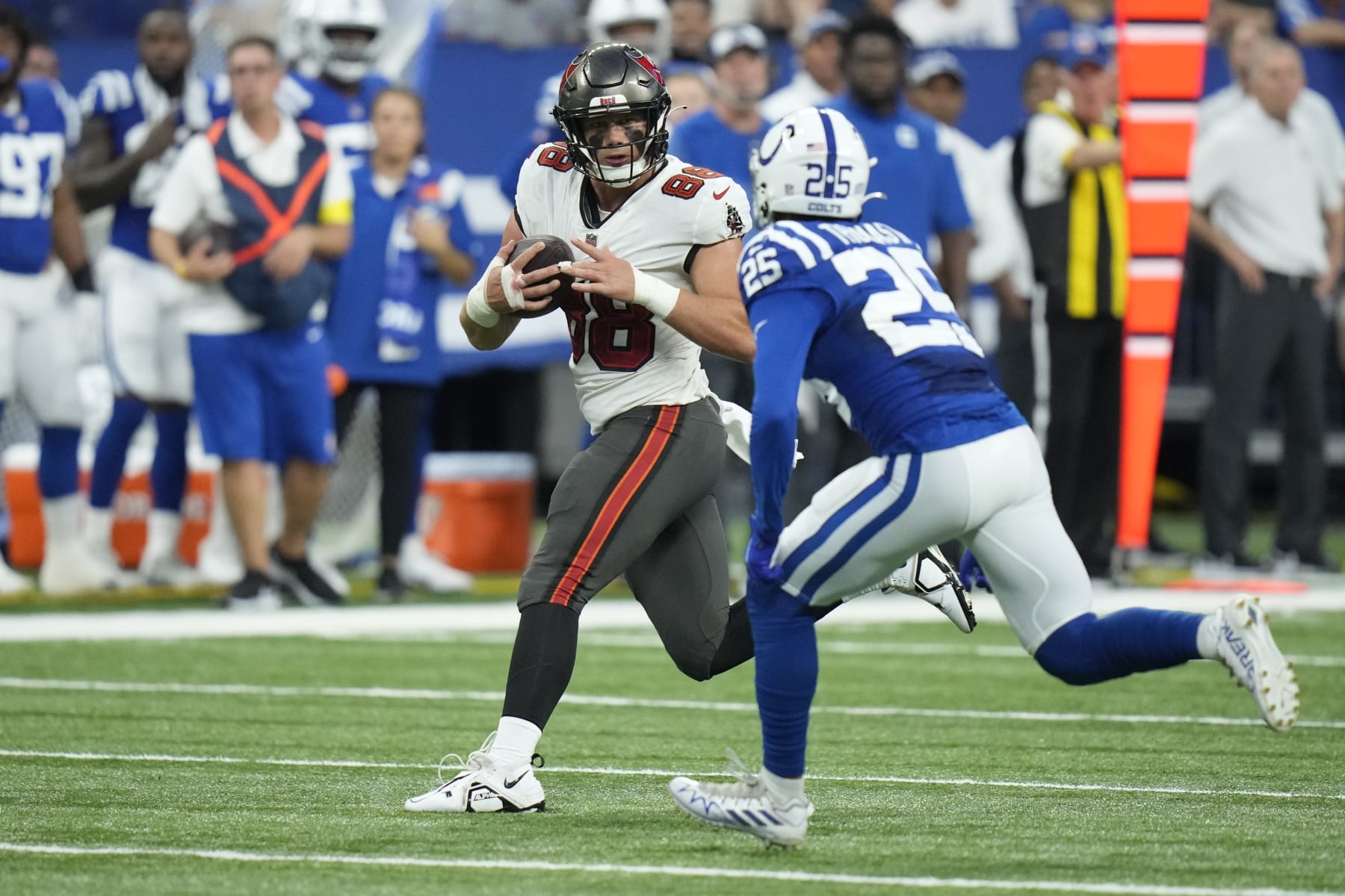 Tampa Bay Buccaneers tight end Cade Otton (88) tries to get past Indianapolis Colts safety Rodney Thomas II (25) in the first half of an NFL preseason football game in Indianapolis, Saturday, Aug. 27, 2022. (AP Photo/AJ Mast)