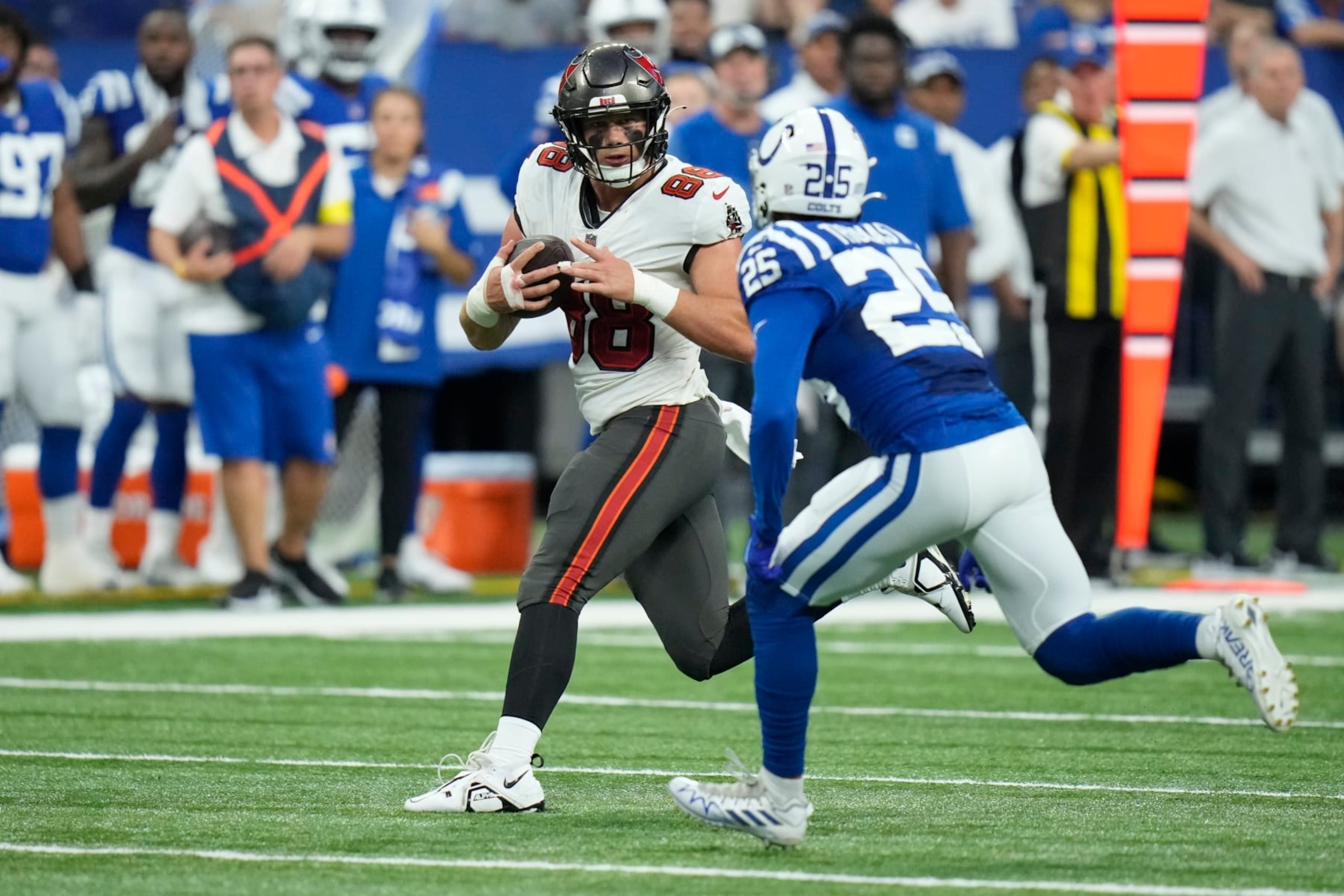 Tampa Bay Buccaneers tight end Cade Otton (88) tries to get past Indianapolis Colts safety Rodney Thomas II (25) in the first half of an NFL preseason football game in Indianapolis, Saturday, Aug. 27, 2022. (AP Photo/AJ Mast)