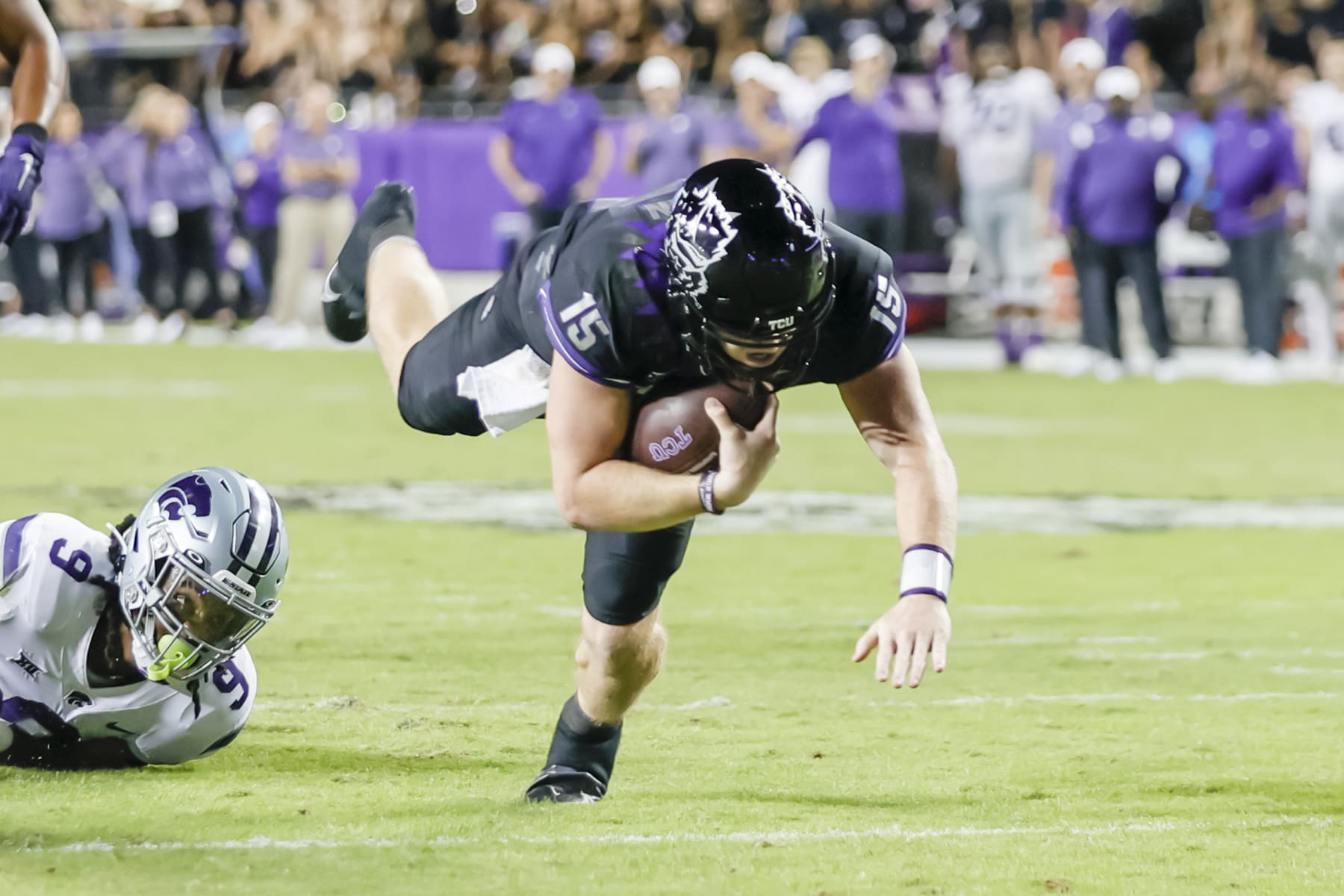 FORT WORTH, TX - OCTOBER 22: TCU Horned Frogs quarterback Max Duggan (15) gets tripped up and dives for a first down during the game between the TCU Horned Frogs and the Kansas State Wildcats on October 22, 2022 at Amon G. Carter Stadium in Fort Worth, Texas. (Photo by Matthew Pearce/Icon Sportswire via Getty Images)