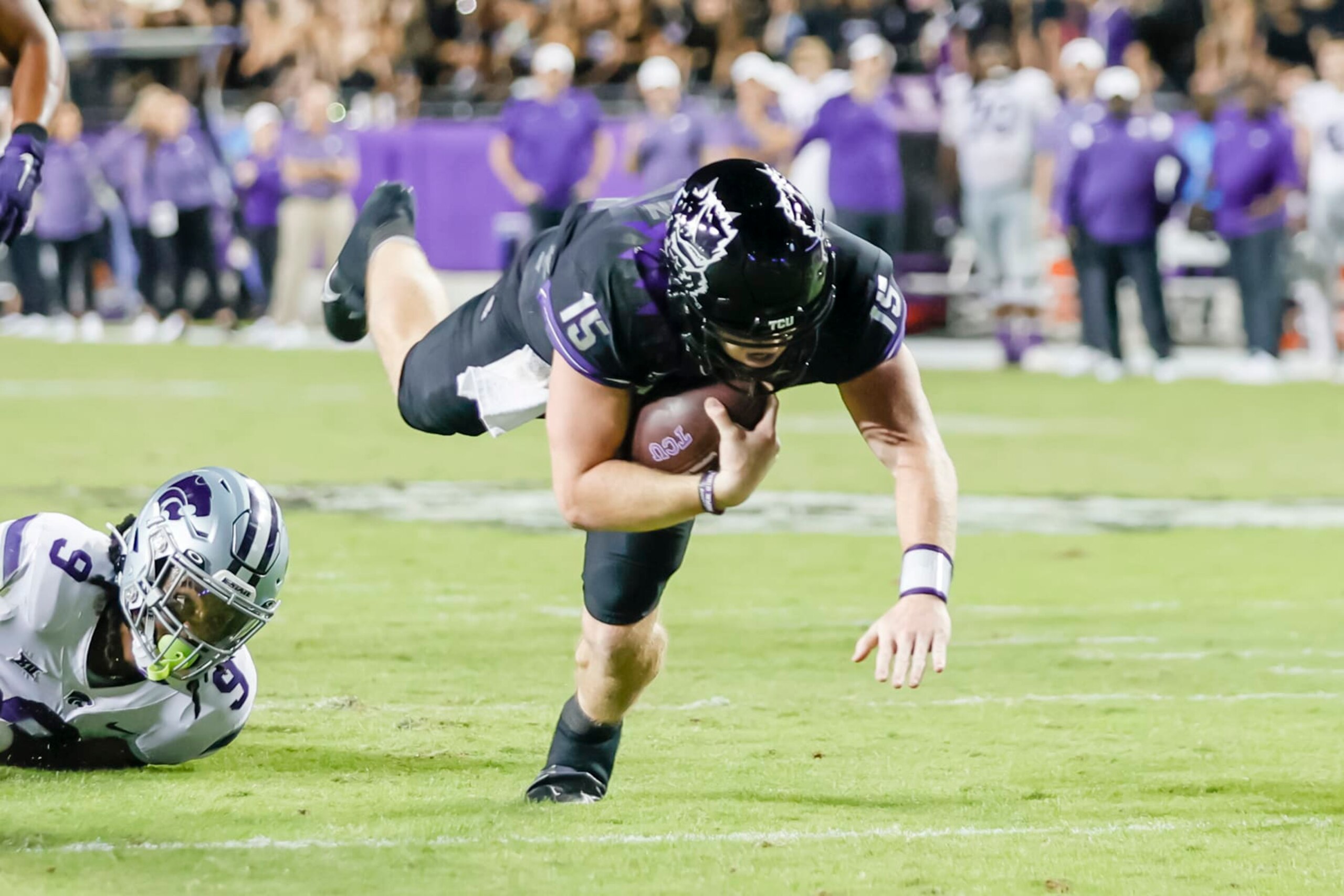 FORT WORTH, TX - OCTOBER 22: TCU Horned Frogs quarterback Max Duggan (15) gets tripped up and dives for a first down during the game between the TCU Horned Frogs and the Kansas State Wildcats on October 22, 2022 at Amon G. Carter Stadium in Fort Worth, Texas. (Photo by Matthew Pearce/Icon Sportswire via Getty Images)