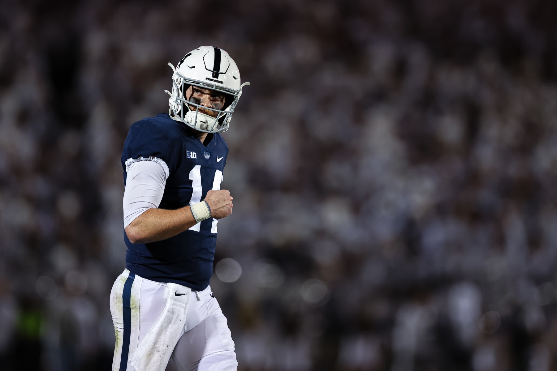 STATE COLLEGE, PA - OCTOBER 22: Sean Clifford #14 of the Penn State Nittany Lions celebrates after a play against the Minnesota Golden Gophers during the second half at Beaver Stadium on October 22, 2022 in State College, Pennsylvania. (Photo by Scott Taetsch/Getty Images)