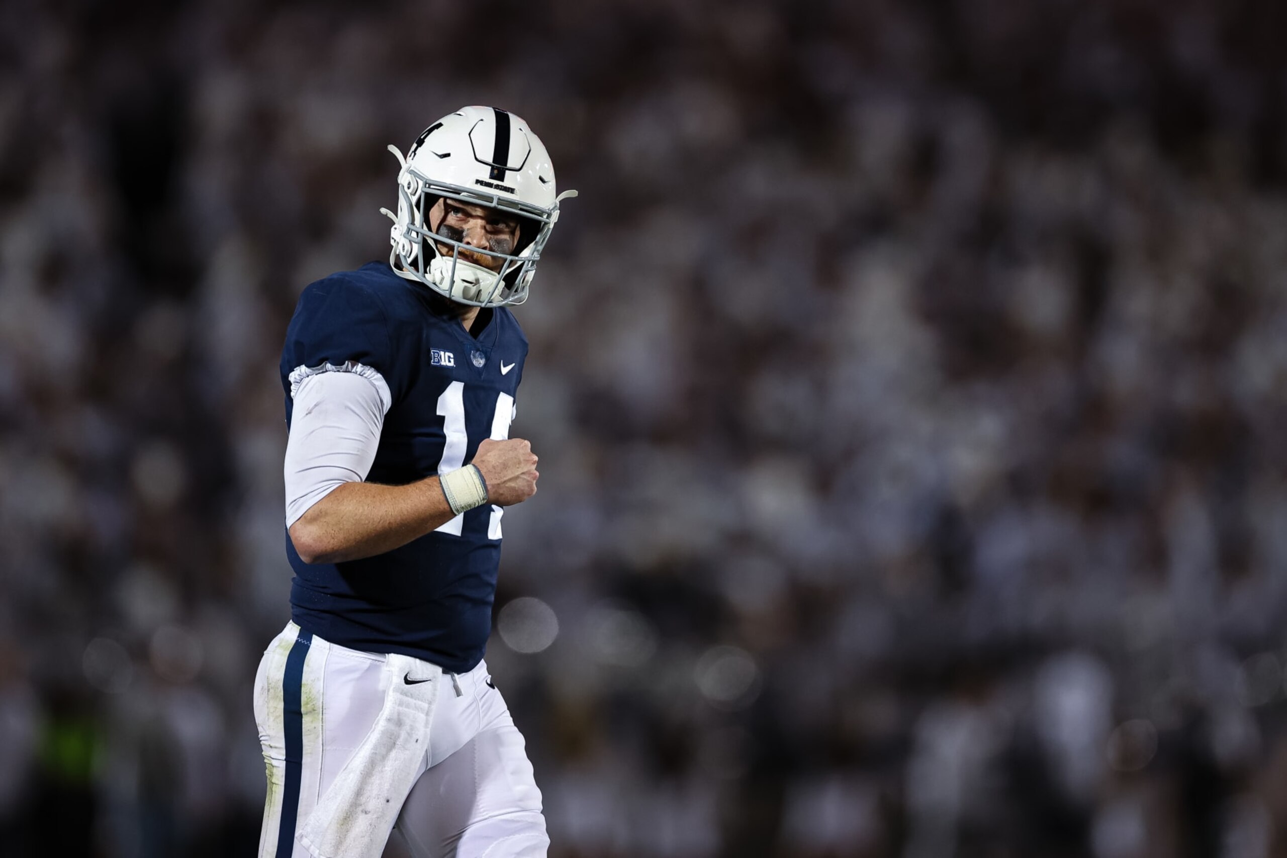 STATE COLLEGE, PA - OCTOBER 22: Sean Clifford #14 of the Penn State Nittany Lions celebrates after a play against the Minnesota Golden Gophers during the second half at Beaver Stadium on October 22, 2022 in State College, Pennsylvania. (Photo by Scott Taetsch/Getty Images)