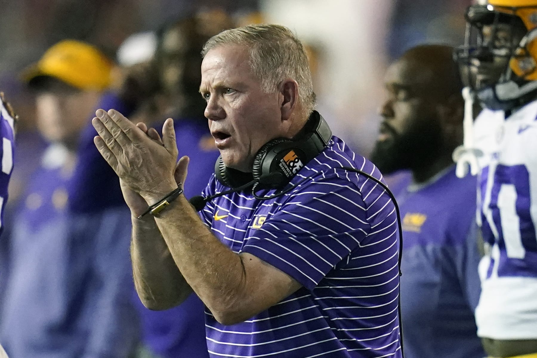 LSU head coach Brian Kelly encourages his players during the second half of an NCAA college football game against Florida, Saturday, Oct. 15, 2022, in Gainesville, Fla. (AP Photo/John Raoux)