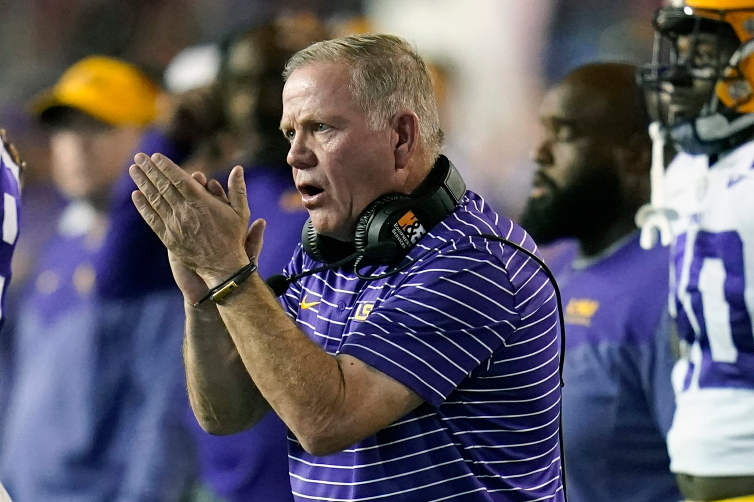 LSU head coach Brian Kelly encourages his players during the second half of an NCAA college football game against Florida, Saturday, Oct. 15, 2022, in Gainesville, Fla. (AP Photo/John Raoux)