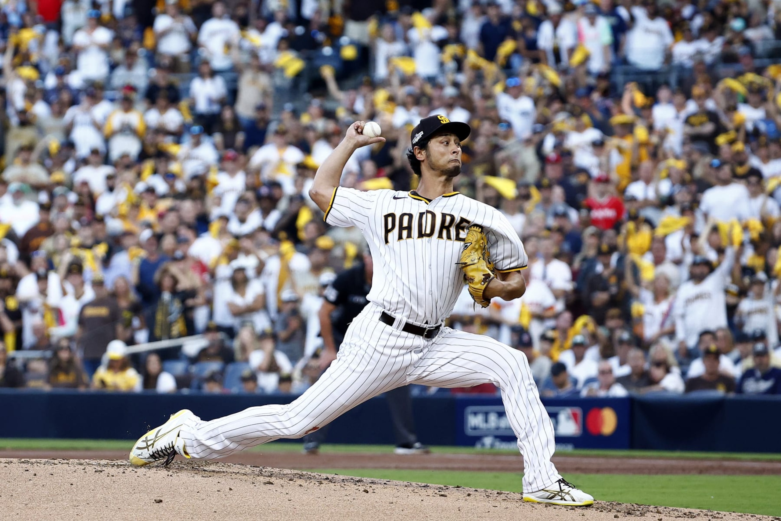 SAN DIEGO, CALIFORNIA - OCTOBER 18: Yu Darvish #11 of the San Diego Padres pitches during the second inning against the Philadelphia Phillies in game one of the National League Championship Series at PETCO Park on October 18, 2022 in San Diego, California. (Photo by Ronald Martinez/Getty Images)