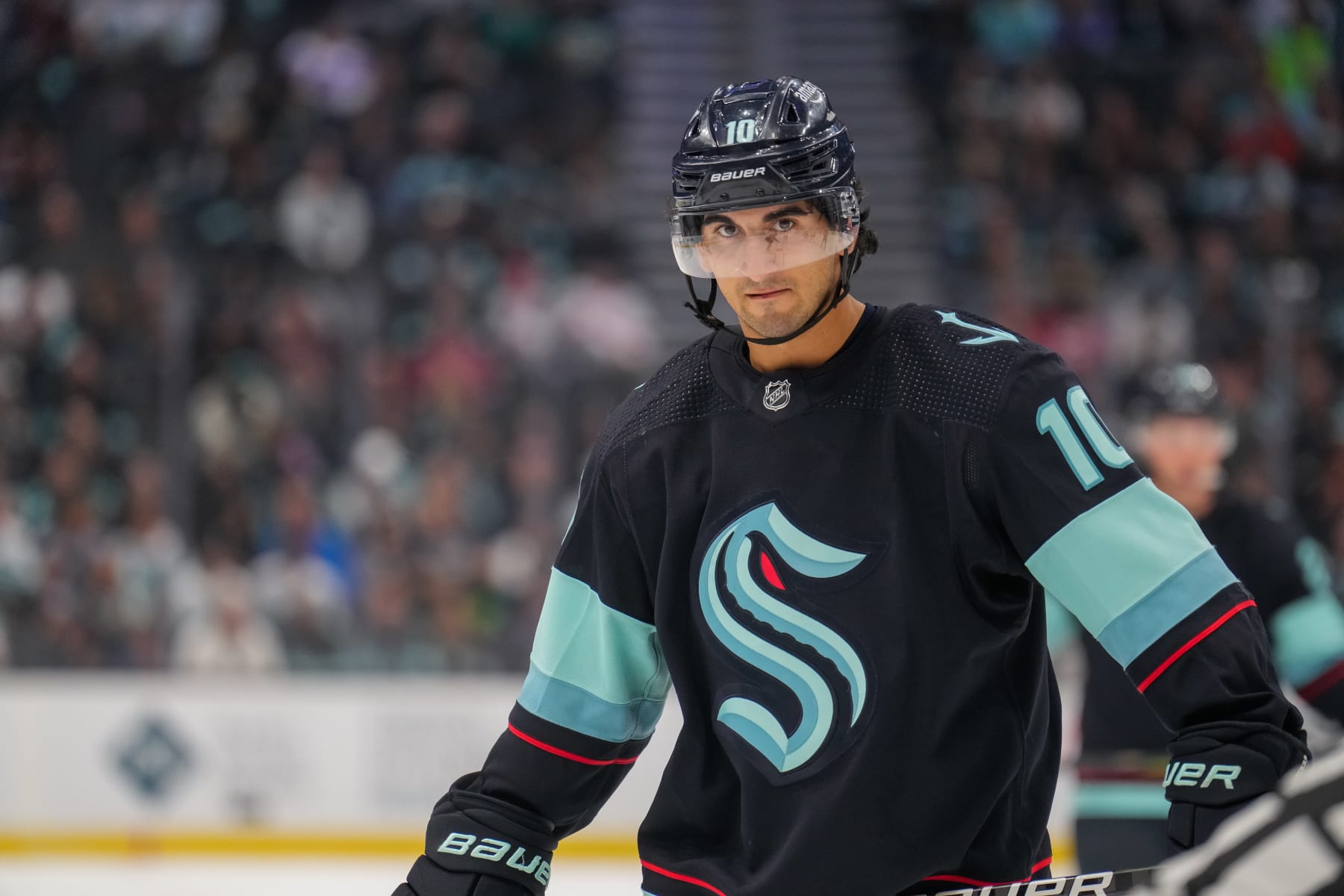 SEATTLE, WASHINGTON - OCTOBER 17: Matty Beniers #10 of the Seattle Kraken prepares to take a face off during the third period of a game against the Carolina Hurricanes at Climate Pledge Arena on October 17, 2022 in Seattle, Washington. (Photo by Christopher Mast/NHLI via Getty Images)