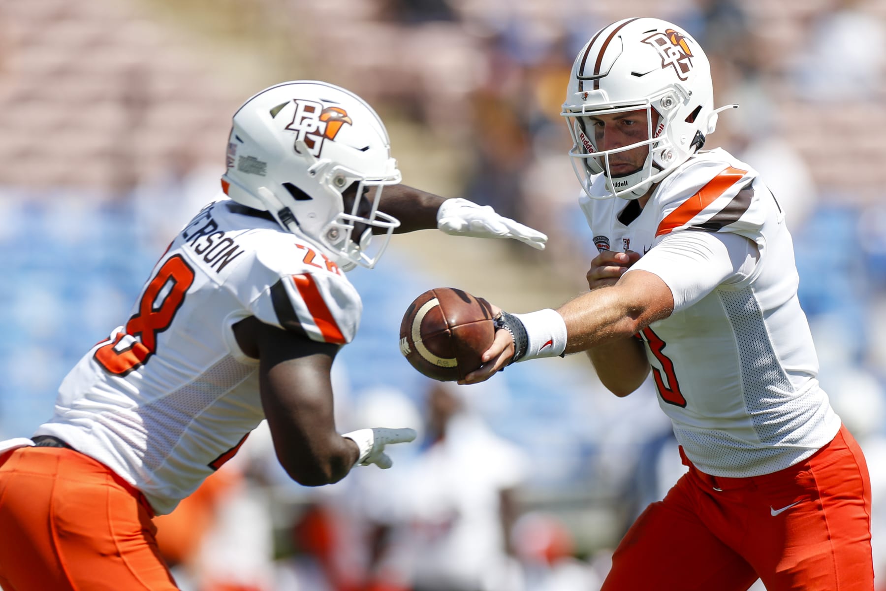 PASADENA, CA - SEPTEMBER 03: Bowling Green Falcons quarterback Matt McDonald (3) hands the ball off to running back Jaison Patterson (28) during a college football game against the Bowling Green Falcons on September 03, 2022 at Rose Bowl in Pasadena, CA. (Photo by Brandon Sloter/Icon Sportswire via Getty Images)