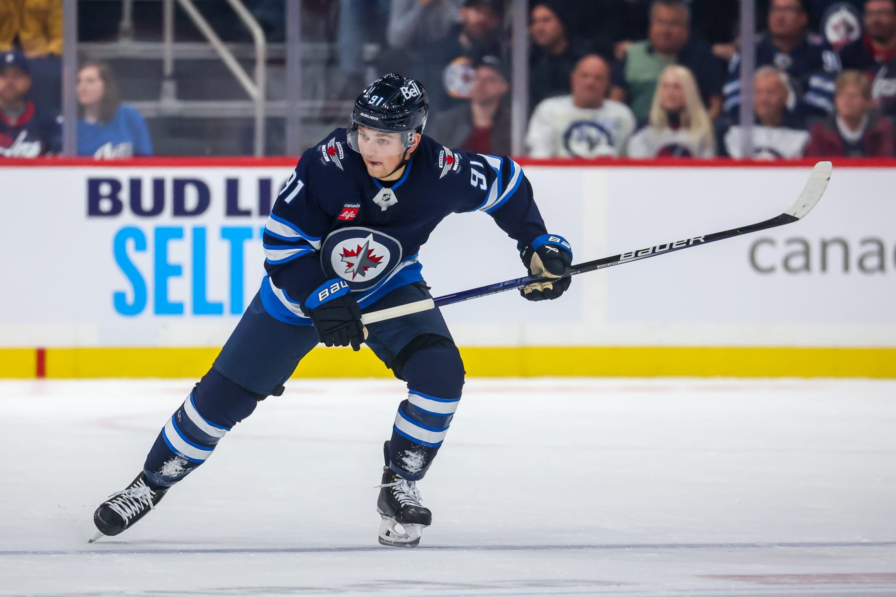 WINNIPEG, CANADA - OCTOBER 14: Cole Perfetti #91 of the Winnipeg Jets follows the play up the ice during second period action against the New York Rangers at Canada Life Centre on October 14, 2022 in Winnipeg, Manitoba, Canada. (Photo by Jonathan Kozub/NHLI via Getty Images)