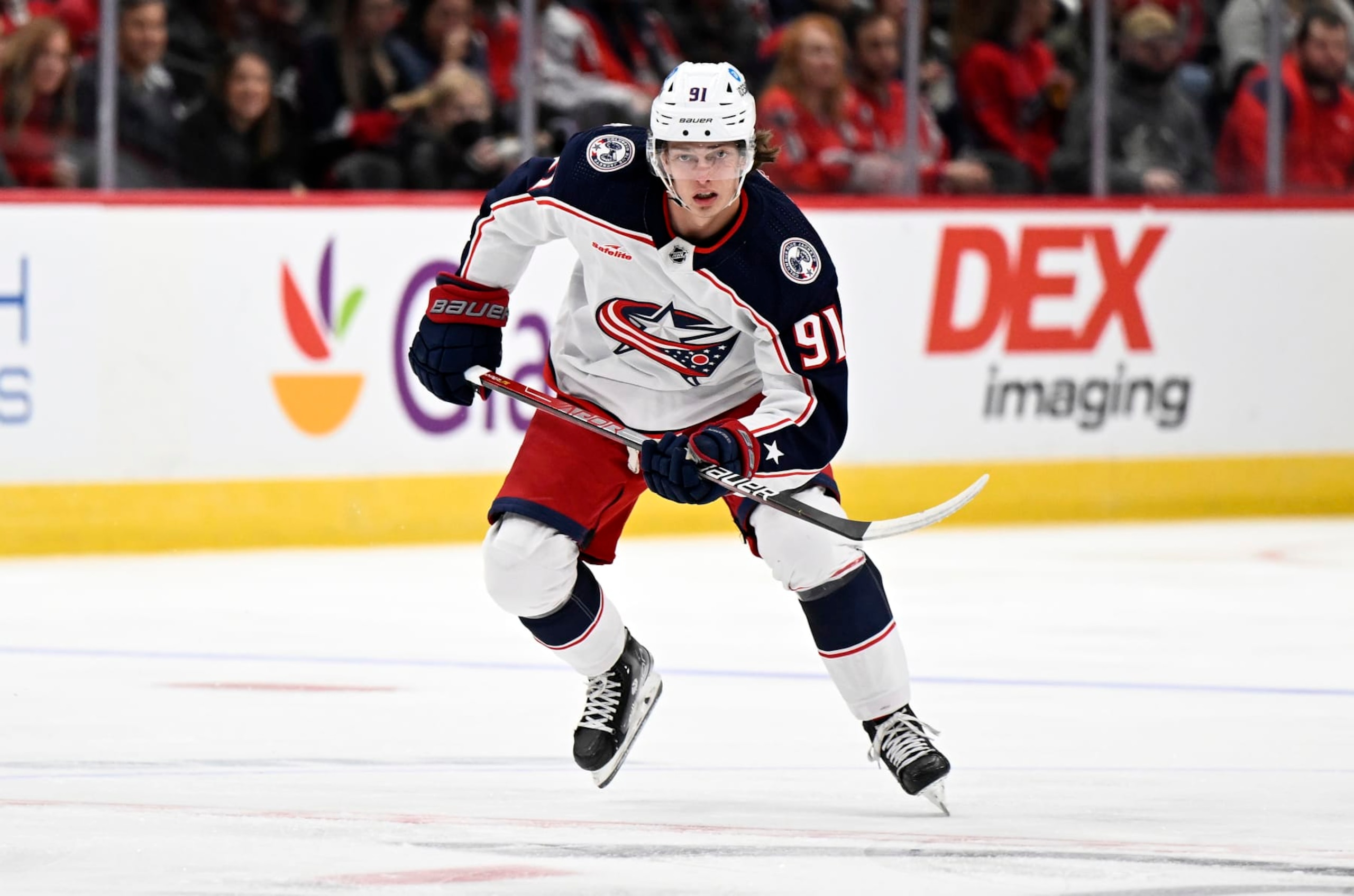 WASHINGTON, DC - OCTOBER 08: Kent Johnson #91 of the Columbus Blue Jackets skates down the ice against the Washington Capitals during a preseason game at Capital One Arena on October 08, 2022 in Washington, DC. (Photo by G Fiume/Getty Images)