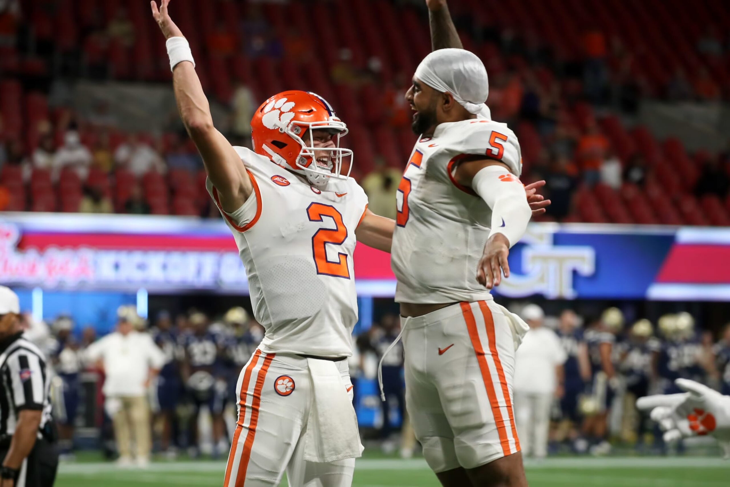 ATLANTA, GA - SEPTEMBER 05: Clemson Tigers quarterback Cade Klubnik (2) and Clemson Tigers quarterback DJ Uiagalelei (5) do a chest bump after a 4th quarter score during the game between the Clemson Tigers and the Georgia Tech Yellow Jackets on September 5, 2022 at Mercedes-Benz Stadium in Atlanta, Georgia. (Photo by Michael Wade/Icon Sportswire via Getty Images)