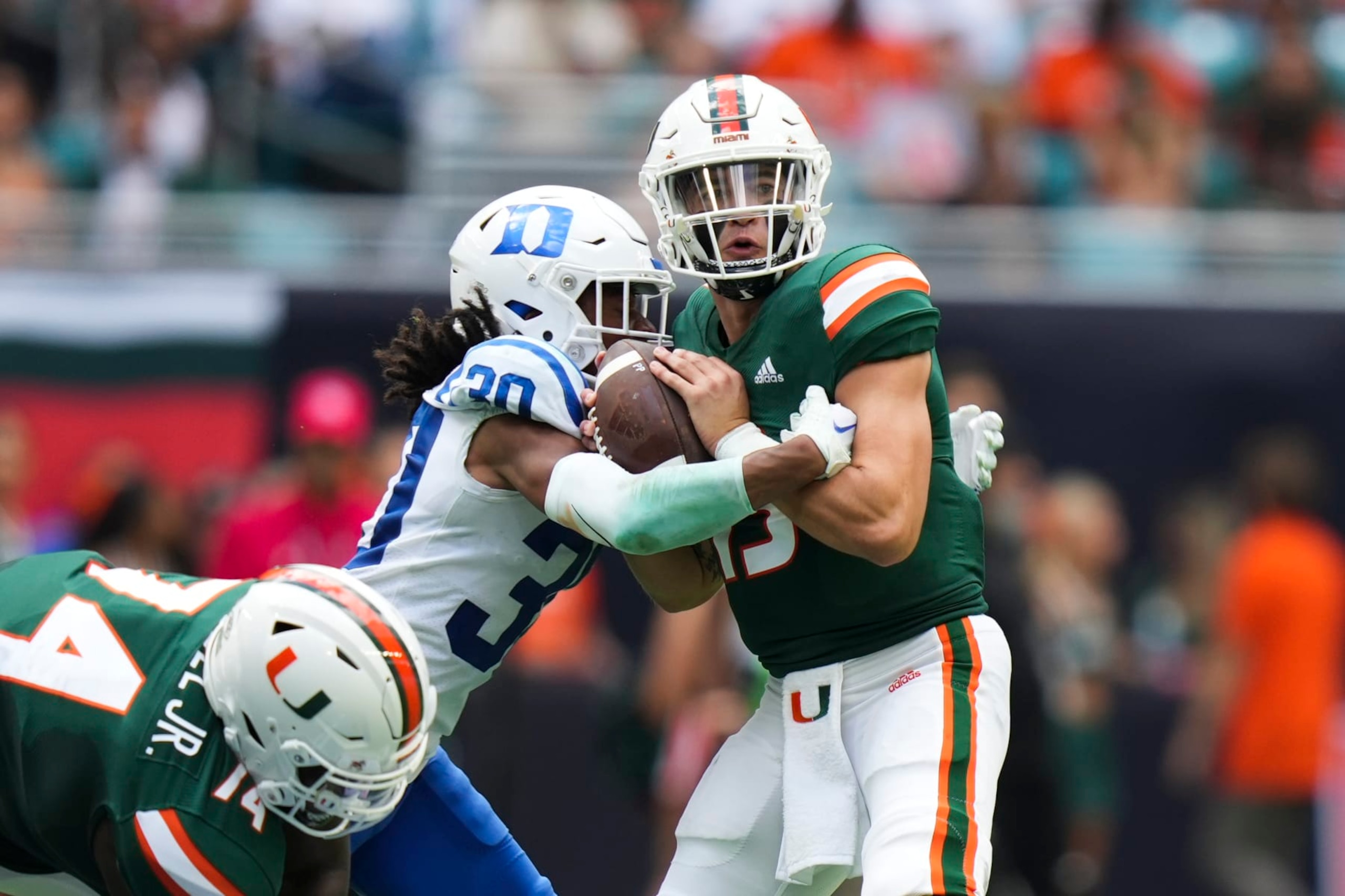 MIAMI GARDENS, FL - OCTOBER 22: Miami Hurricanes quarterback Jake Garcia (13) gets sacked by Duke Blue Devils defensive back Brandon Johnson (30) during the game between the Duke Blue Devils and the Miami Hurricanes on Saturday, October 22, 2022 at Hard Rock Stadium, Miami Gardens, FL (Photo by Peter Joneleit/Icon Sportswire via Getty Images) MIAMI GARDENS, FL - OCTOBER 22: Miami Hurricanes quarterback Jake Garcia (13) gets sacked by Duke Blue Devils defensive back Brandon Johnson (30) during the game between the Duke Blue Devils and the Miami Hurricanes on Saturday, October 22, 2022 at Hard Rock Stadium, Miami Gardens, FL (Photo by Peter Joneleit/Icon Sportswire via Getty Images)