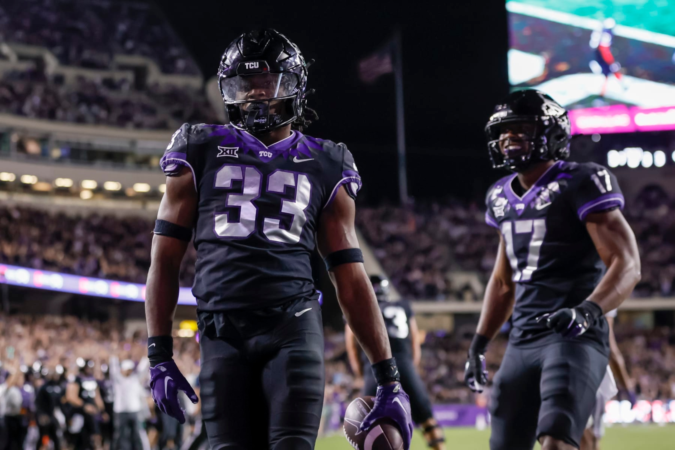 FORT WORTH, TX - OCTOBER 22: TCU Horned Frogs running back Kendre Miller (33) scores a touchdown during the game between the TCU Horned Frogs and the Kansas State Wildcats on October 22, 2022 at Amon G. Carter Stadium in Fort Worth, Texas. (Photo by Matthew Pearce/Icon Sportswire via Getty Images)