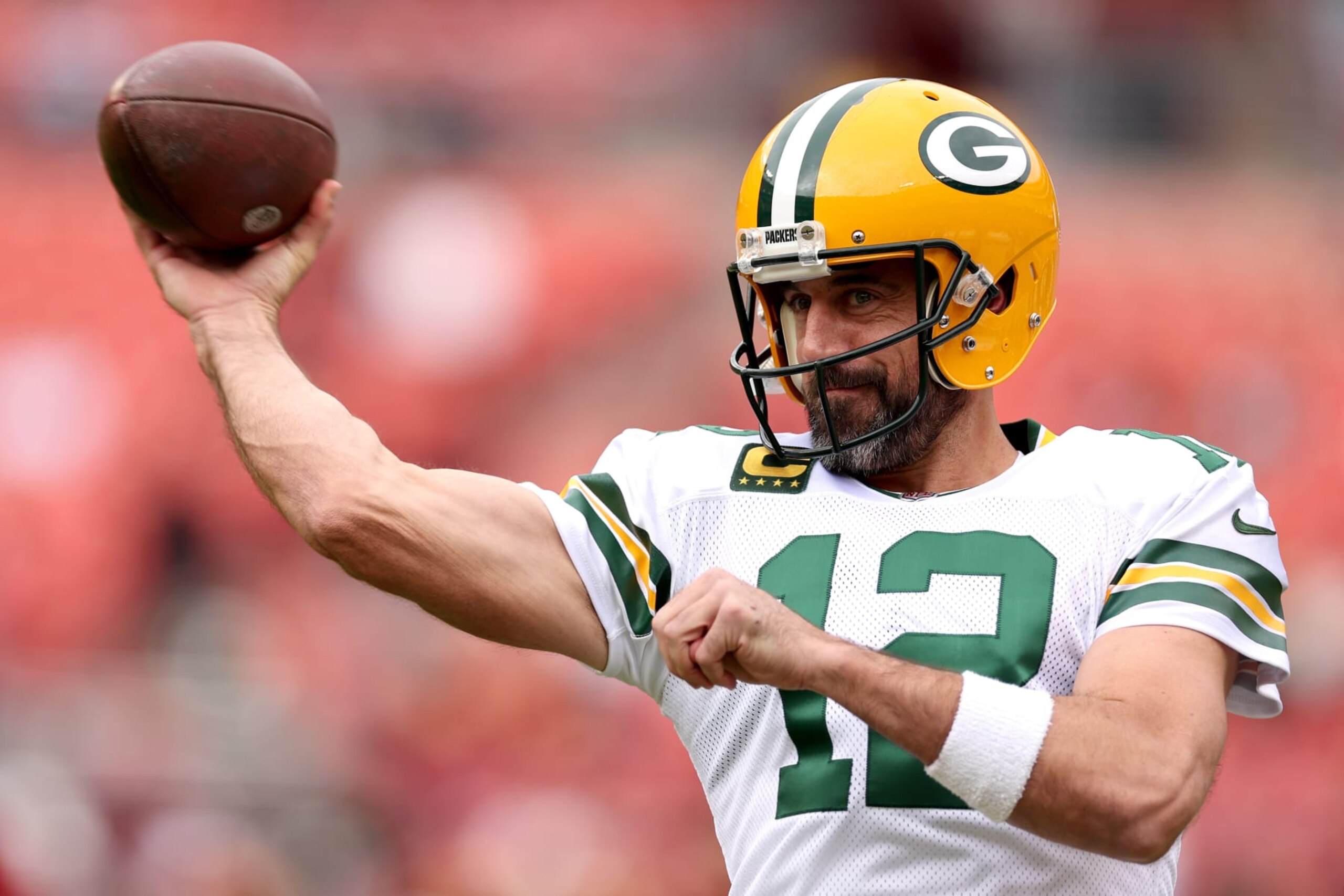 LANDOVER, MARYLAND - OCTOBER 23: Aaron Rodgers #12 of the Green Bay Packers throws the ball during warmups before the game against the Washington Commanders at FedExField on October 23, 2022 in Landover, Maryland. (Photo by Scott Taetsch/Getty Images)