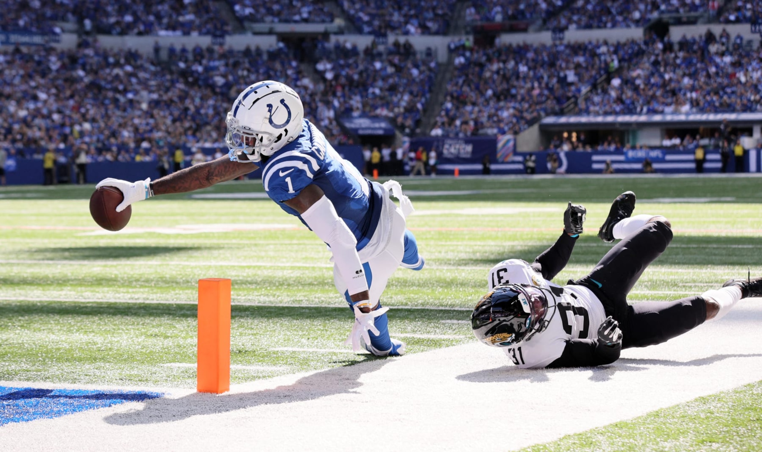 INDIANAPOLIS, INDIANA - OCTOBER 16: Parris Campbell #1 of the Indianapolis Colts dives into the endzone for a touchdown against Darious Williams #31 of the Jacksonville Jaguars during the second quarter at Lucas Oil Stadium on October 16, 2022 in Indianapolis, Indiana.  (Photo by Andy Lyons/Getty Images)