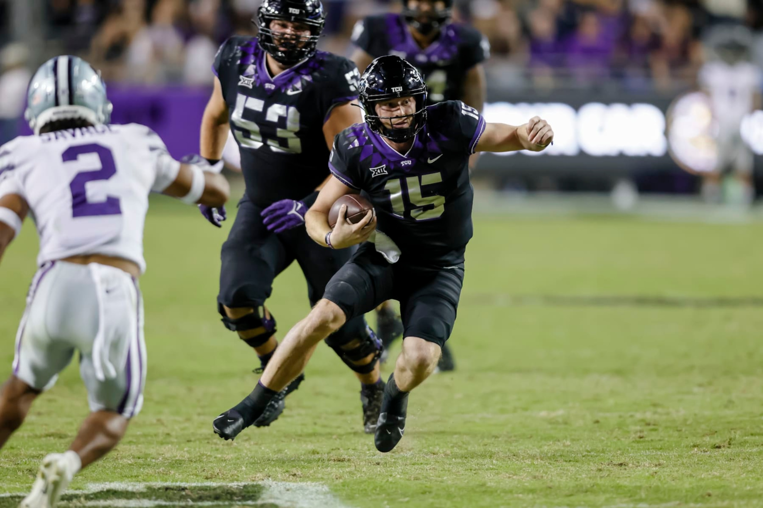 FORT WORTH, TX - OCTOBER 22: TCU Horned Frogs quarterback Max Duggan (15) runs through the line of scrimmage during the game between the TCU Horned Frogs and the Kansas State Wildcats on October 22, 2022 at Amon G. Carter Stadium in Fort Worth, Texas. (Photo by Matthew Pearce/Icon Sportswire via Getty Images) FORT WORTH, TX - OCTOBER 22: TCU Horned Frogs quarterback Max Duggan (15) runs through the line of scrimmage during the game between the TCU Horned Frogs and the Kansas State Wildcats on October 22, 2022 at Amon G. Carter Stadium in Fort Worth, Texas. (Photo by Matthew Pearce/Icon Sportswire via Getty Images)