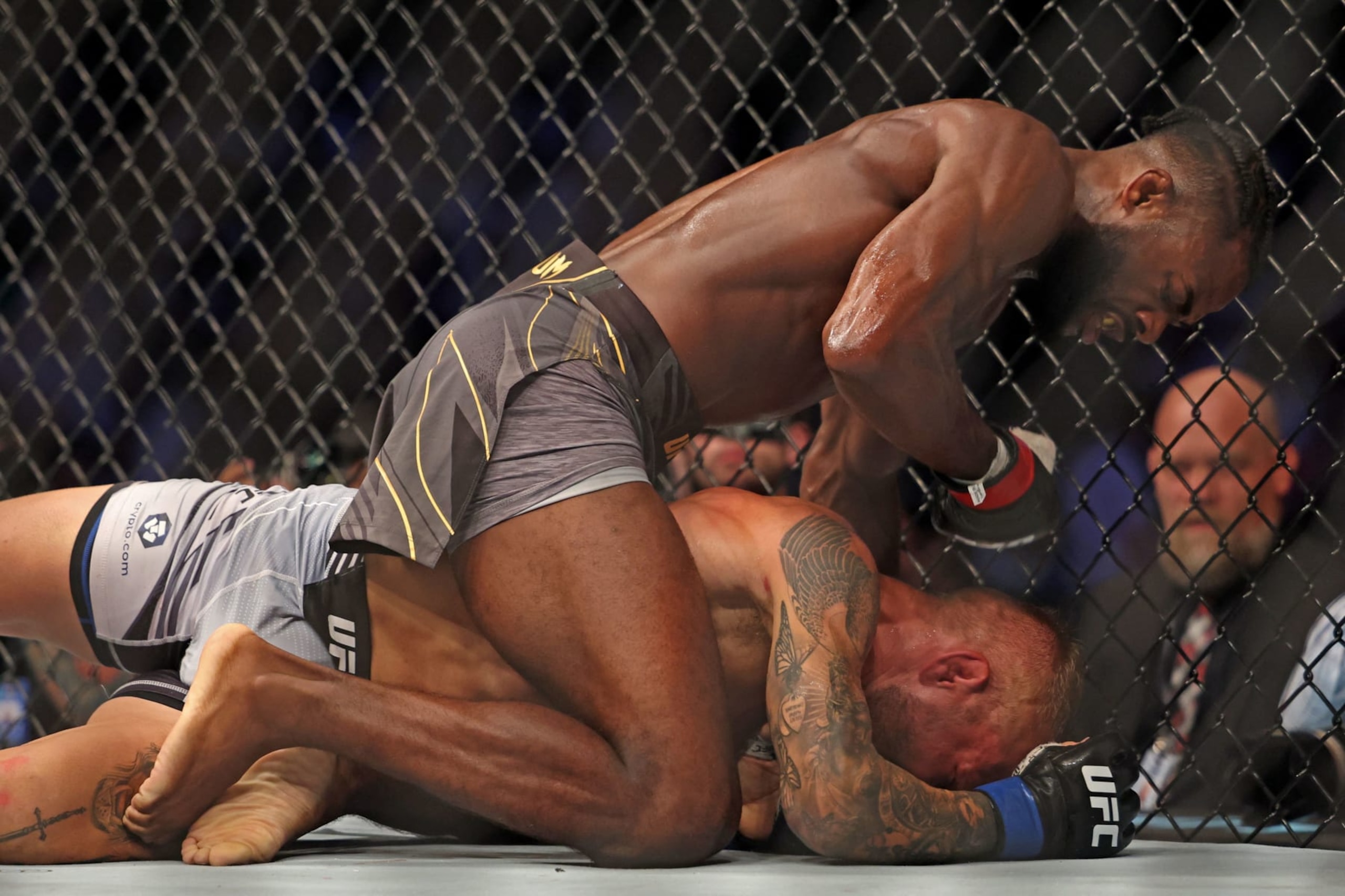 Aljamain Sterling (L) competes against TJ Dillashaw in the bantamweight championship at the Ultimate Fighting Championship (UFC) event at the Etihad Arena in Abu Dhabi on October 22, 2022. (Photo by Giuseppe CACACE / AFP) (Photo by GIUSEPPE CACACE/AFP via Getty Images)