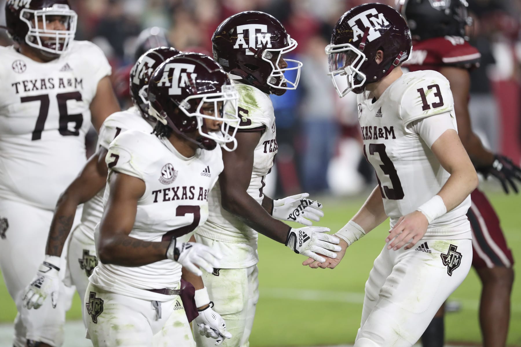 Texas A&M quarterback Haynes King (13) congratulates running back Devon Achane (6), who scored a touchdown during the second half of the team's NCAA college football game against South Carolina on Saturday, Oct. 22, 2022, in Columbia, S.C. (AP Photo/Artie Walker Jr.)