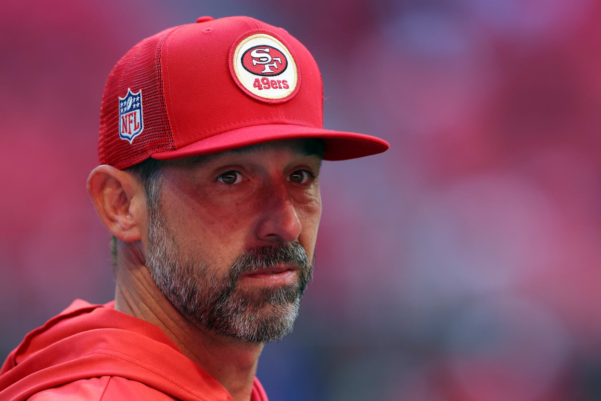 ATLANTA, GEORGIA - OCTOBER 16: Head coach Kyle Shanahan of the San Francisco 49ers looks onward prior to a game against the Atlanta Falcons at Mercedes-Benz Stadium on October 16, 2022 in Atlanta, Georgia. (Photo by Kevin C. Cox/Getty Images)