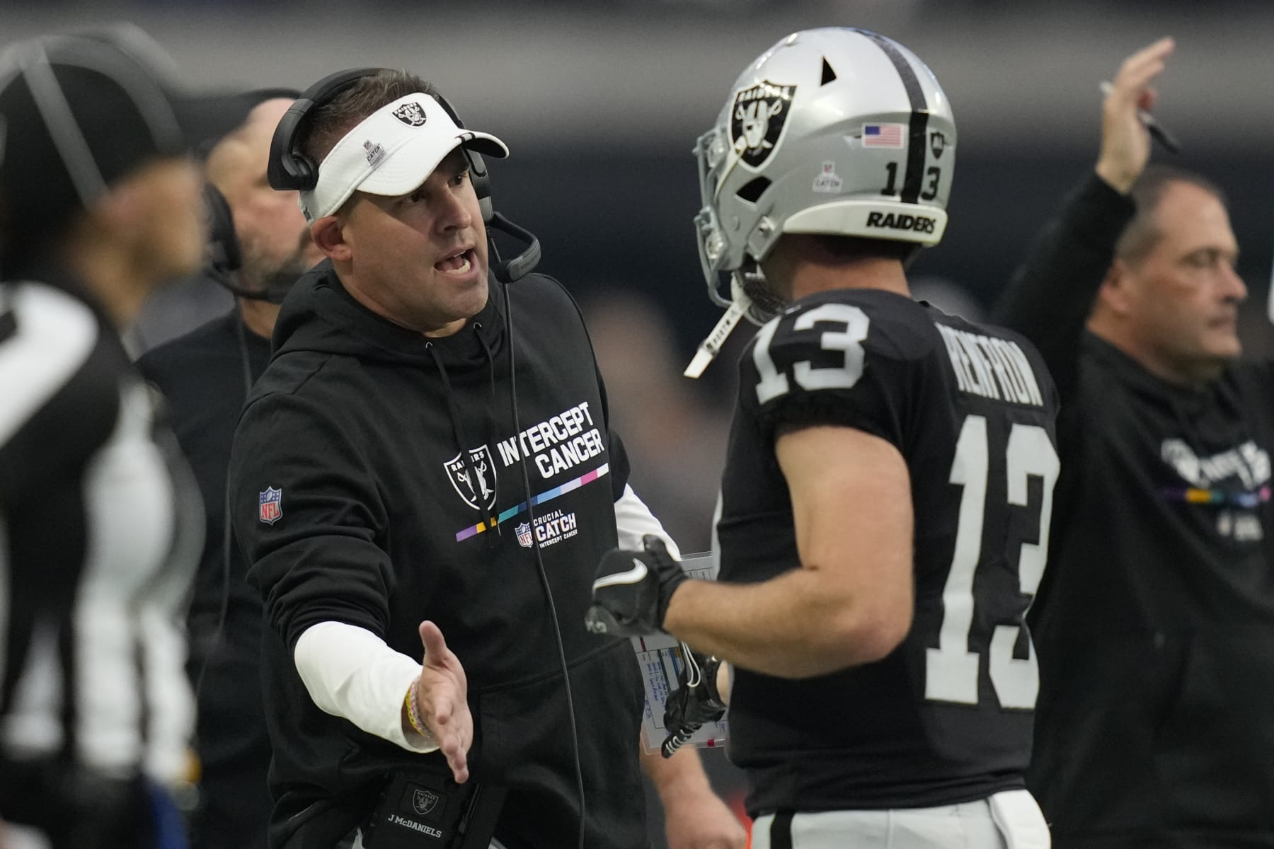 Las Vegas Raiders Josh McDaniels, left, greets wide receiver Hunter Renfrow after a touchdown during the second half of an NFL football game against the Houston Texans, Sunday, Oct. 23, 2022, in Las Vegas. (AP Photo/John Locher) Las Vegas Raiders Josh McDaniels, left, greets wide receiver Hunter Renfrow after a touchdown during the second half of an NFL football game against the Houston Texans, Sunday, Oct. 23, 2022, in Las Vegas. (AP Photo/John Locher)
