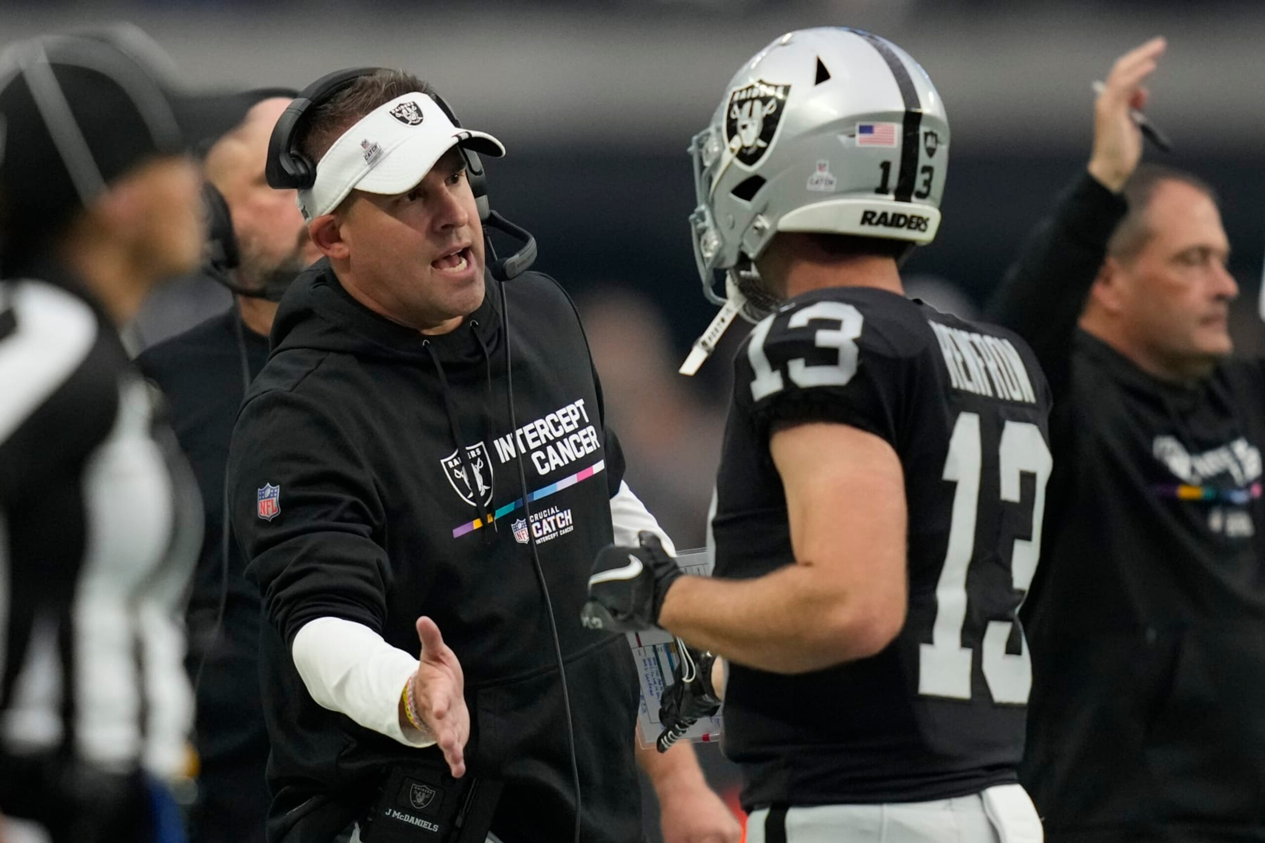 Las Vegas Raiders Josh McDaniels, left, greets wide receiver Hunter Renfrow after a touchdown during the second half of an NFL football game against the Houston Texans, Sunday, Oct. 23, 2022, in Las Vegas. (AP Photo/John Locher)